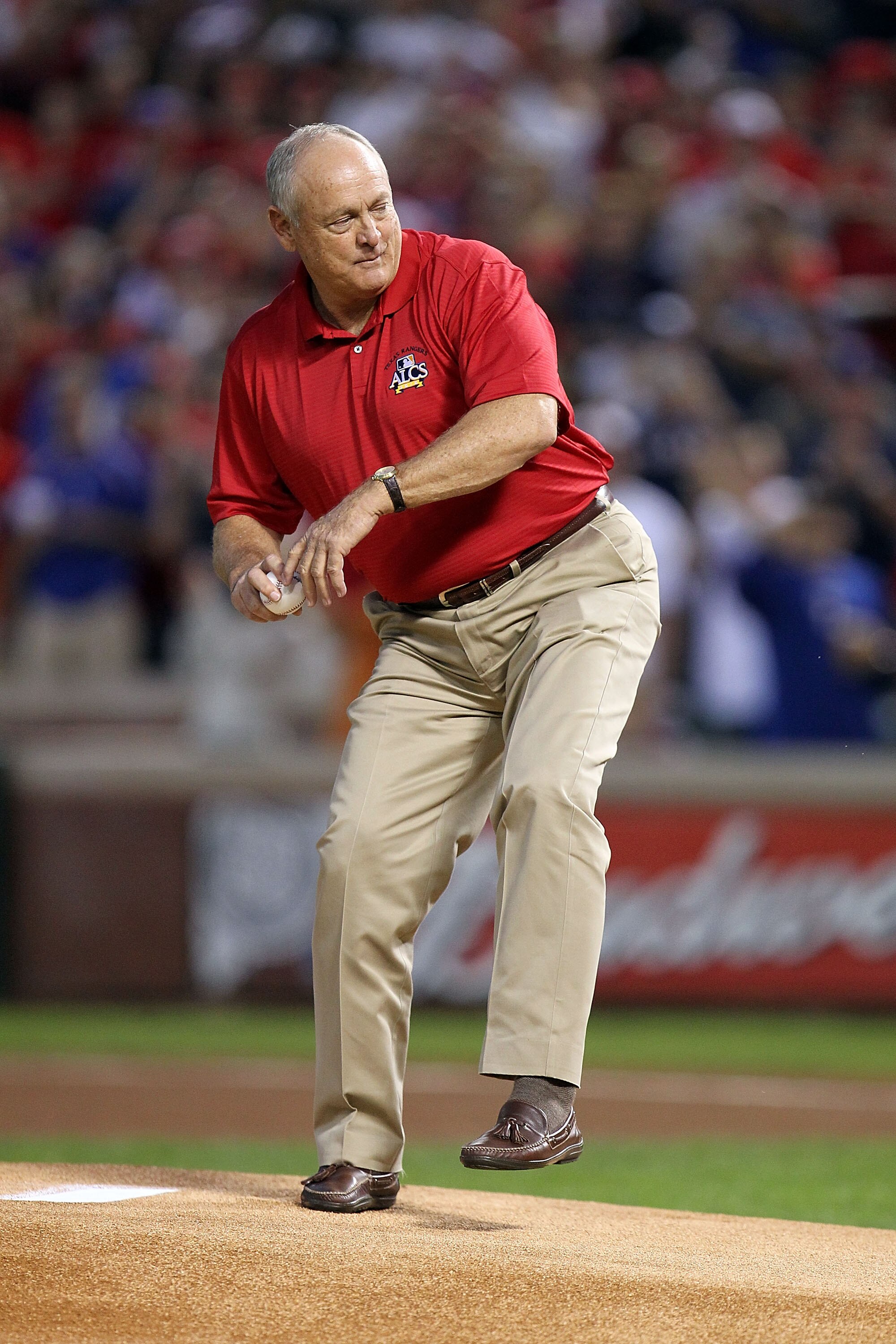 ARLINGTON, TX - OCTOBER 15:  Team President Nolan Ryan of  the Texas Rangers throws out the ceremonial first pitch against the New York Yankees in Game One of the ALCS during the 2010 MLB Playoffs at Rangers Ballpark in Arlington on October 15, 2010 in Ar