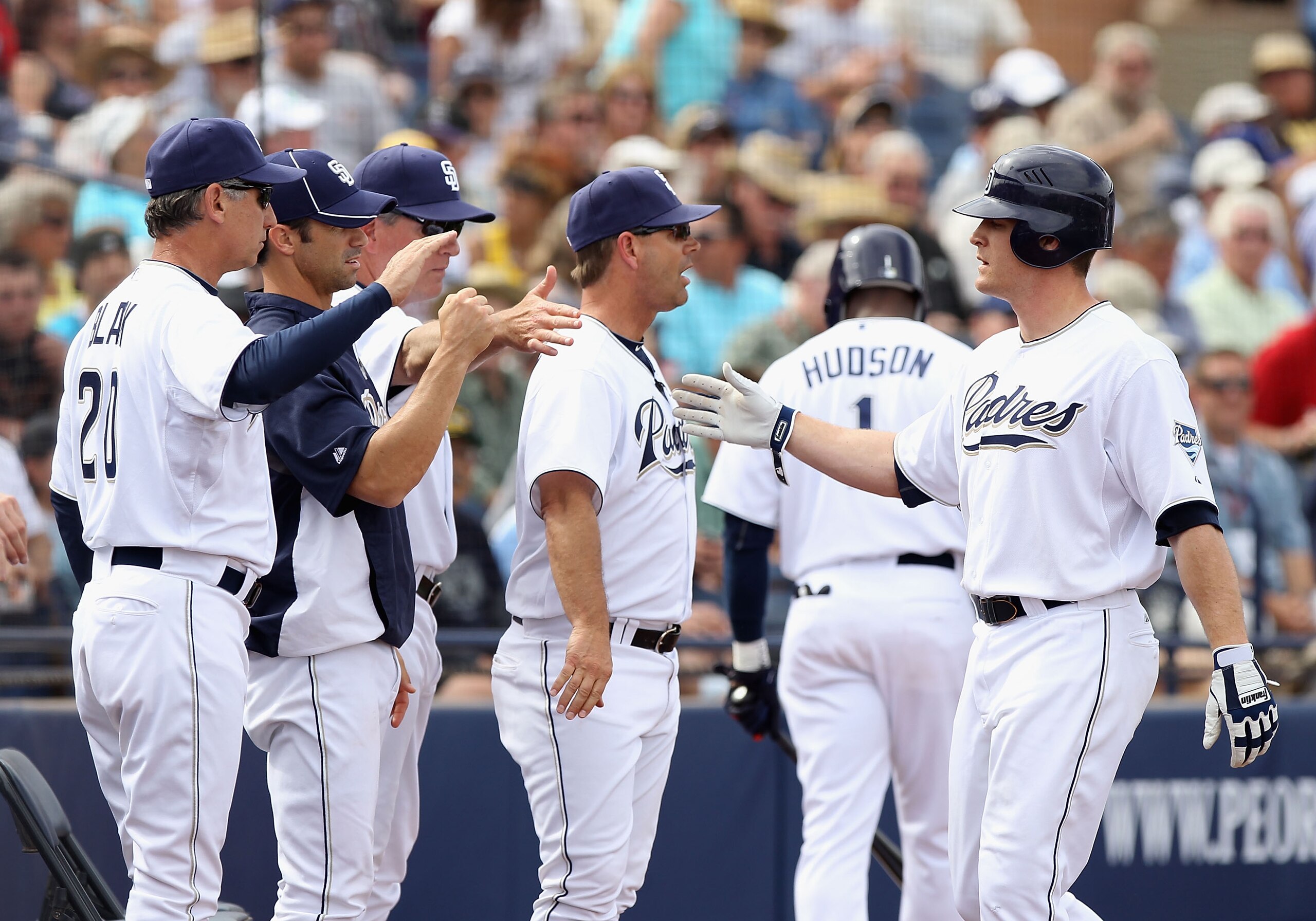 PEORIA, AZ - MARCH 06:  Logan Forsythe #12 of the San Diego Padres high fives manager Bud Black after hitting a 2 run home run against the Oakland Athletics during the second inning of the spring training game at Peoria Stadium on March 6, 2011 in Peoria,