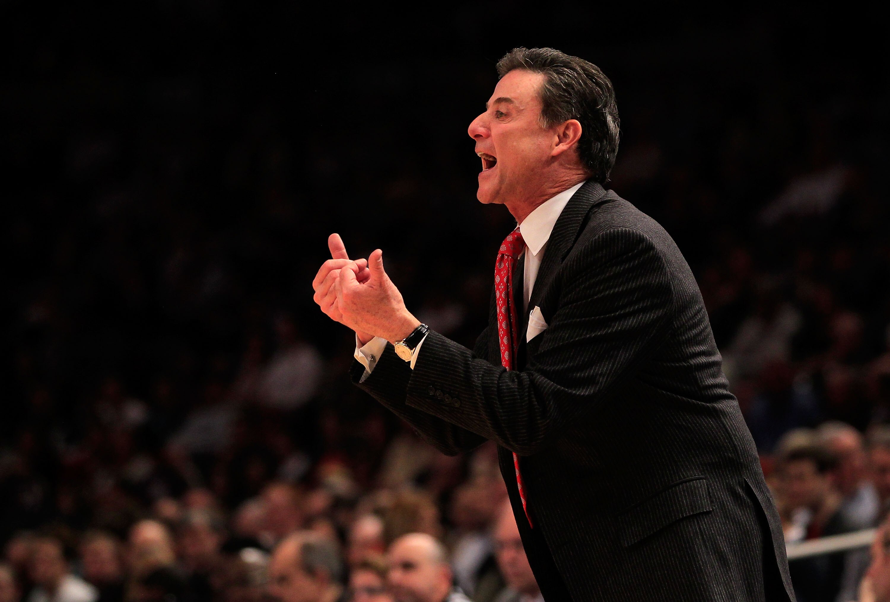 NEW YORK, NY - MARCH 11: head coach Rick Pitino of the Louisville Cardinals looks on from the bench during the game against the Notre Dame Fighting Irish during the semifinals of the 2011 Big East Men's Basketball Tournament presented by American Eagle O NEW YORK, NY - MARCH 11: head coach Rick Pitino of the Louisville Cardinals looks on from the bench during the game against the Notre Dame Fighting Irish during the semifinals of the 2011 Big East Men's Basketball Tournament presented by American Eagle O