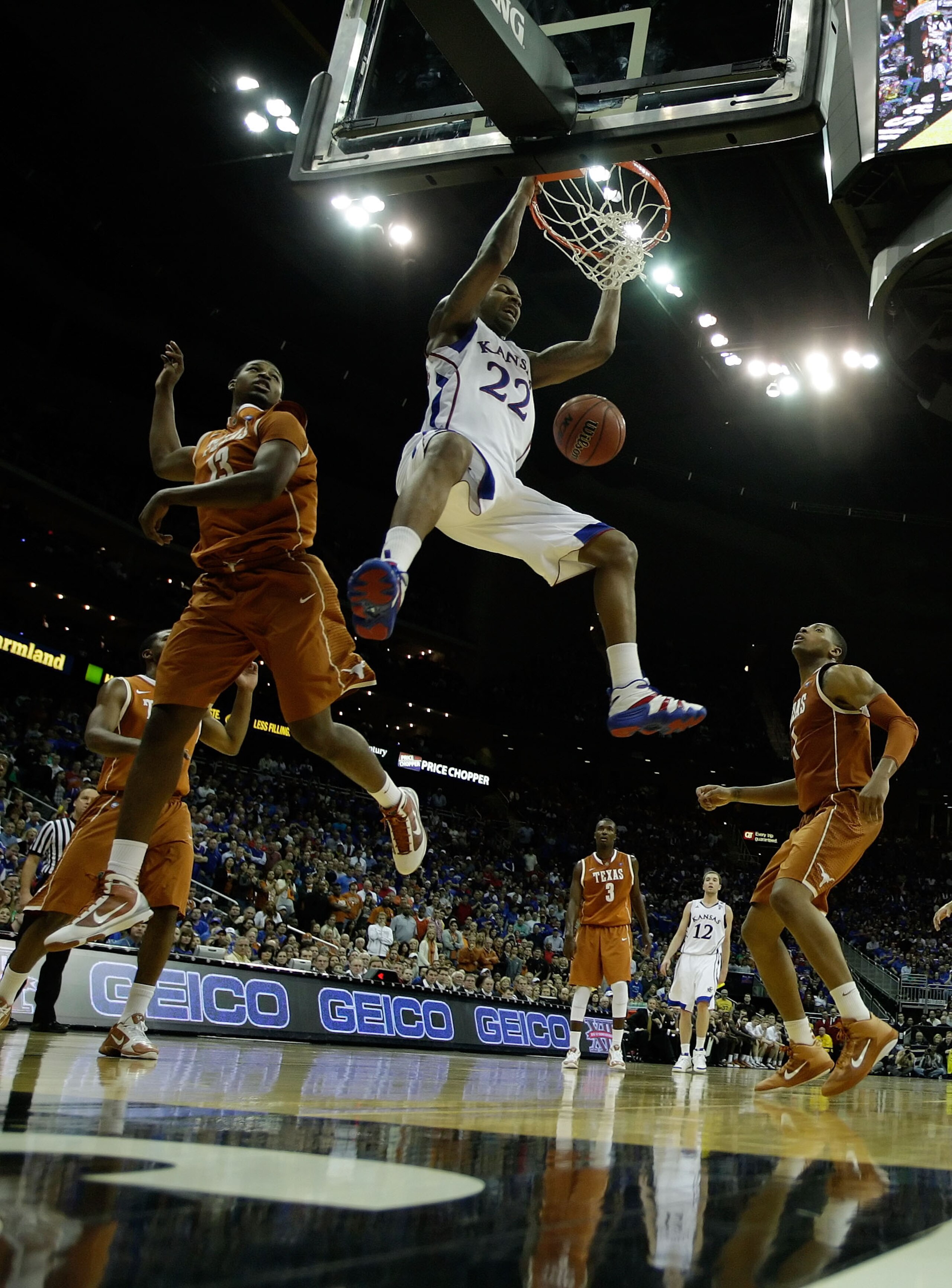 KANSAS CITY, MO - MARCH 12:  Marcus Morris #22 of the Kansas Jayhawks dunks the ball against the Texas Longhorns during the 2011 Phillips 66 Big 12 Men's Basketball Tournament championship game at Sprint Center on March 12, 2011 in Kansas City, Missouri.