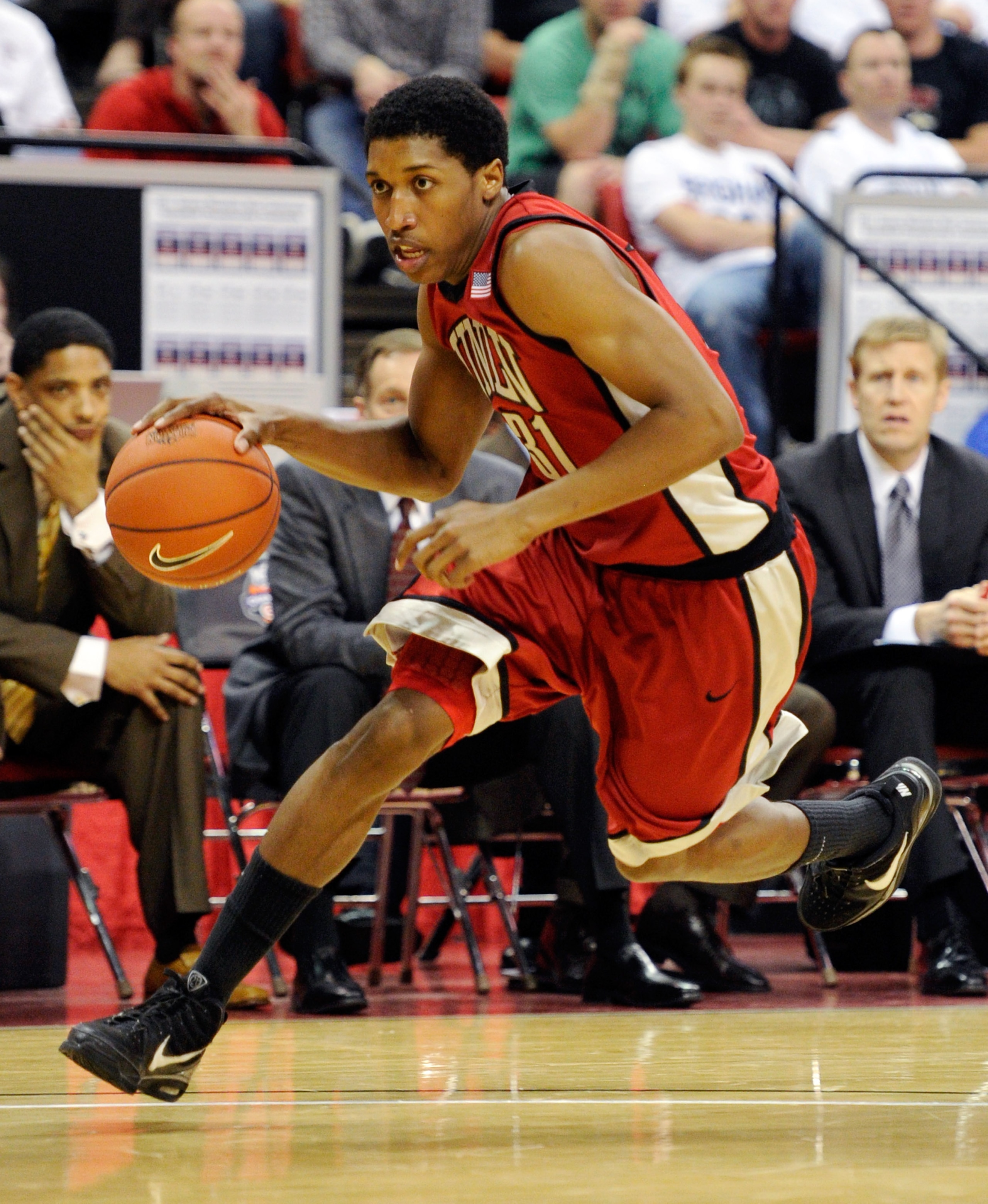 LAS VEGAS, NV - MARCH 11:  Justin Hawkins #31 of the UNLV Rebels drives to the basket during a semifinal game of the Conoco Mountain West Conference Basketball tournament against the San Diego State Aztecs at the Thomas & Mack Center March 11, 2011 in Las