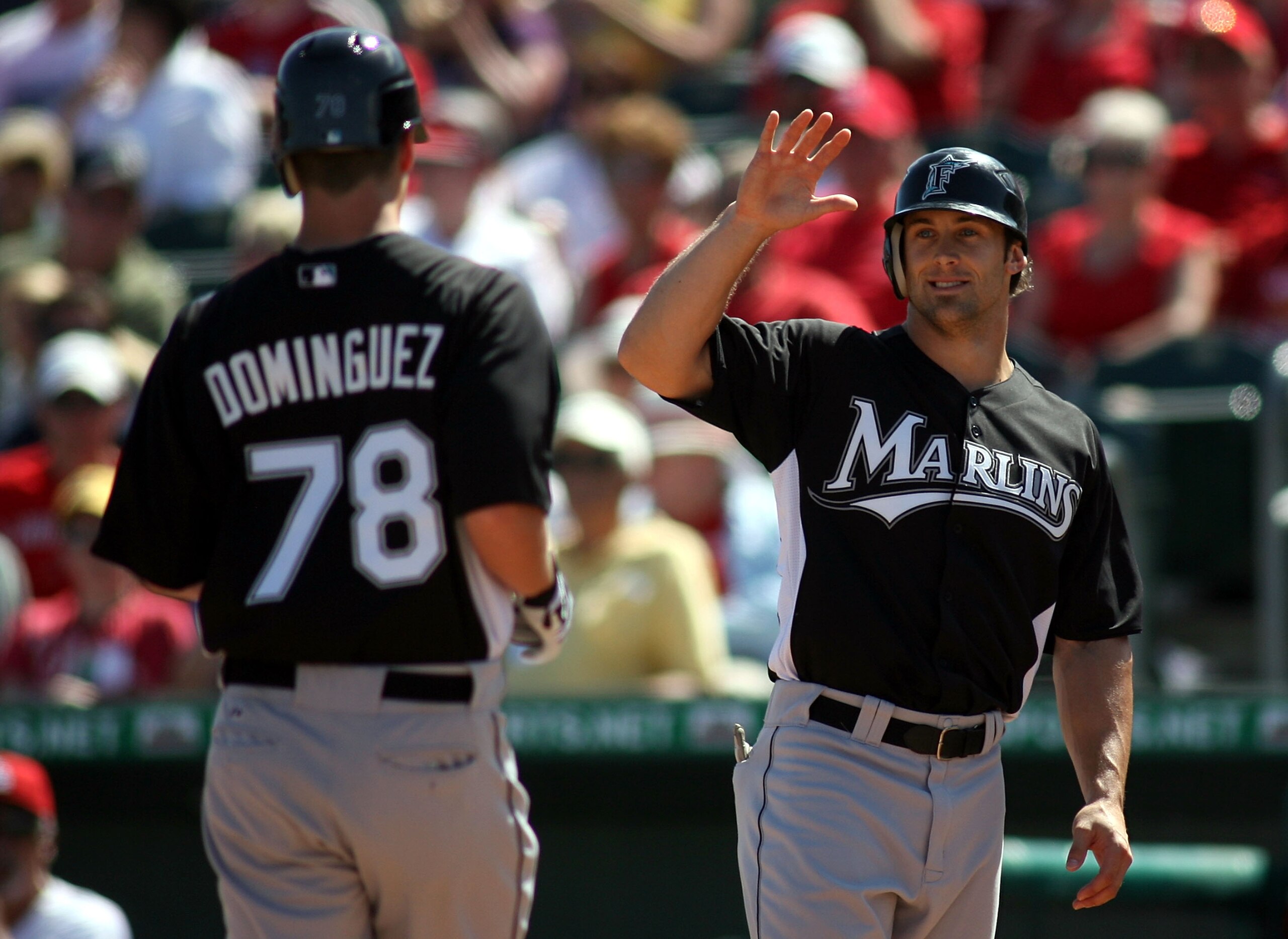 JUPITER, FL - FEBRUARY 28:  Matt Dominguez #78 of the Florida Marlins celebrates a home run with teammate Bryan Peterson against the St. Louis Cardinals at Roger Dean Stadium on February 28, 2011 in Jupiter, Florida.  (Photo by Marc Serota/Getty Images)