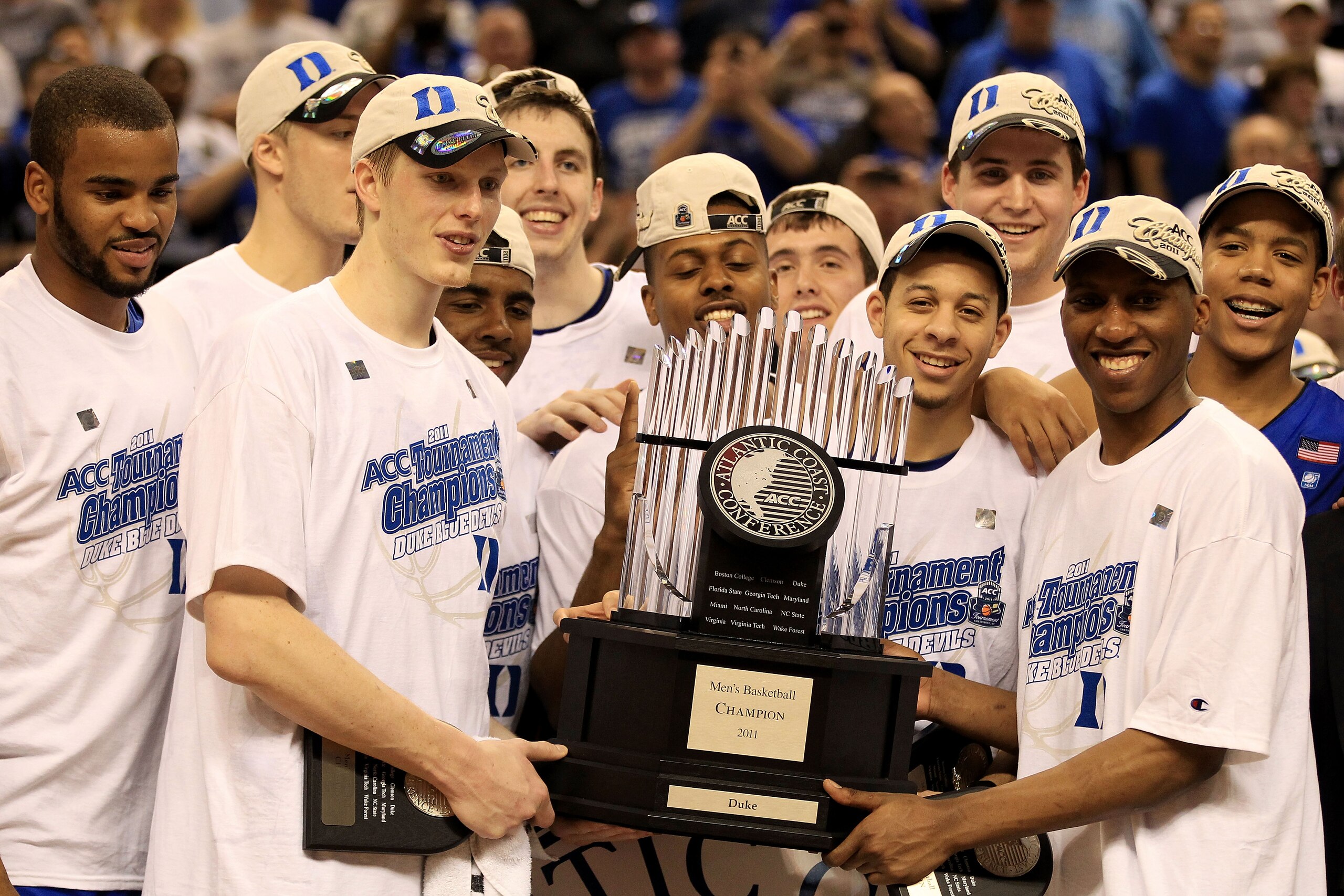 GREENSBORO, NC - MARCH 13:  The Duke Blue Devils celebrate with the ACC Championship Trophy after their 75-58 victory over the North Carolina Tar Heels in the championship game of the 2011 ACC men's basketball tournament at the Greensboro Coliseum on Marc