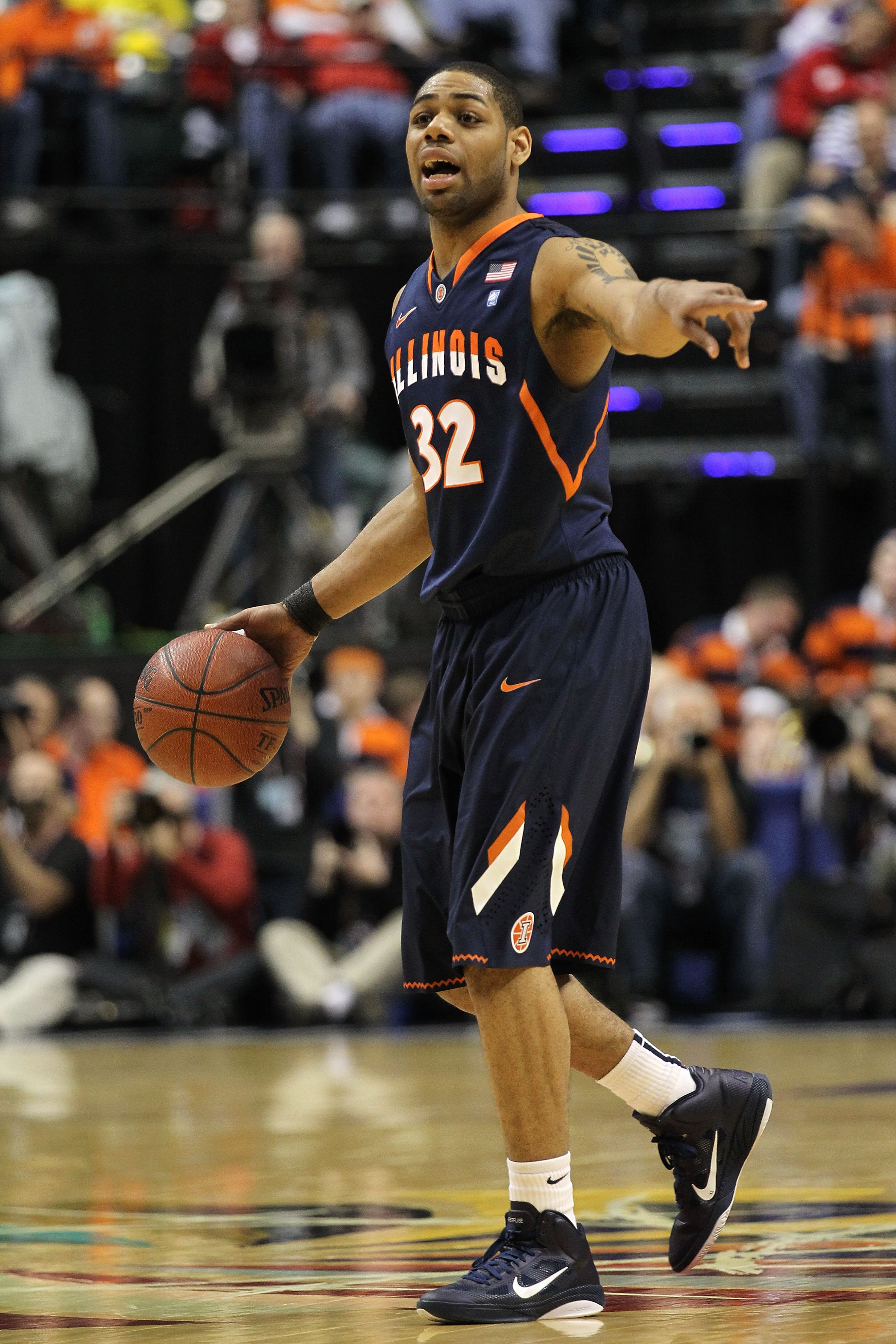 INDIANAPOLIS, IN - MARCH 11:  Demetri McCamey #32 of the Illinois Fighting Illini runs the offense against the Michigan Wolverines during the quarterfinals of the 2011 Big Ten Men's Basketball Tournament at Conseco Fieldhouse on March 11, 2011 in Indianap