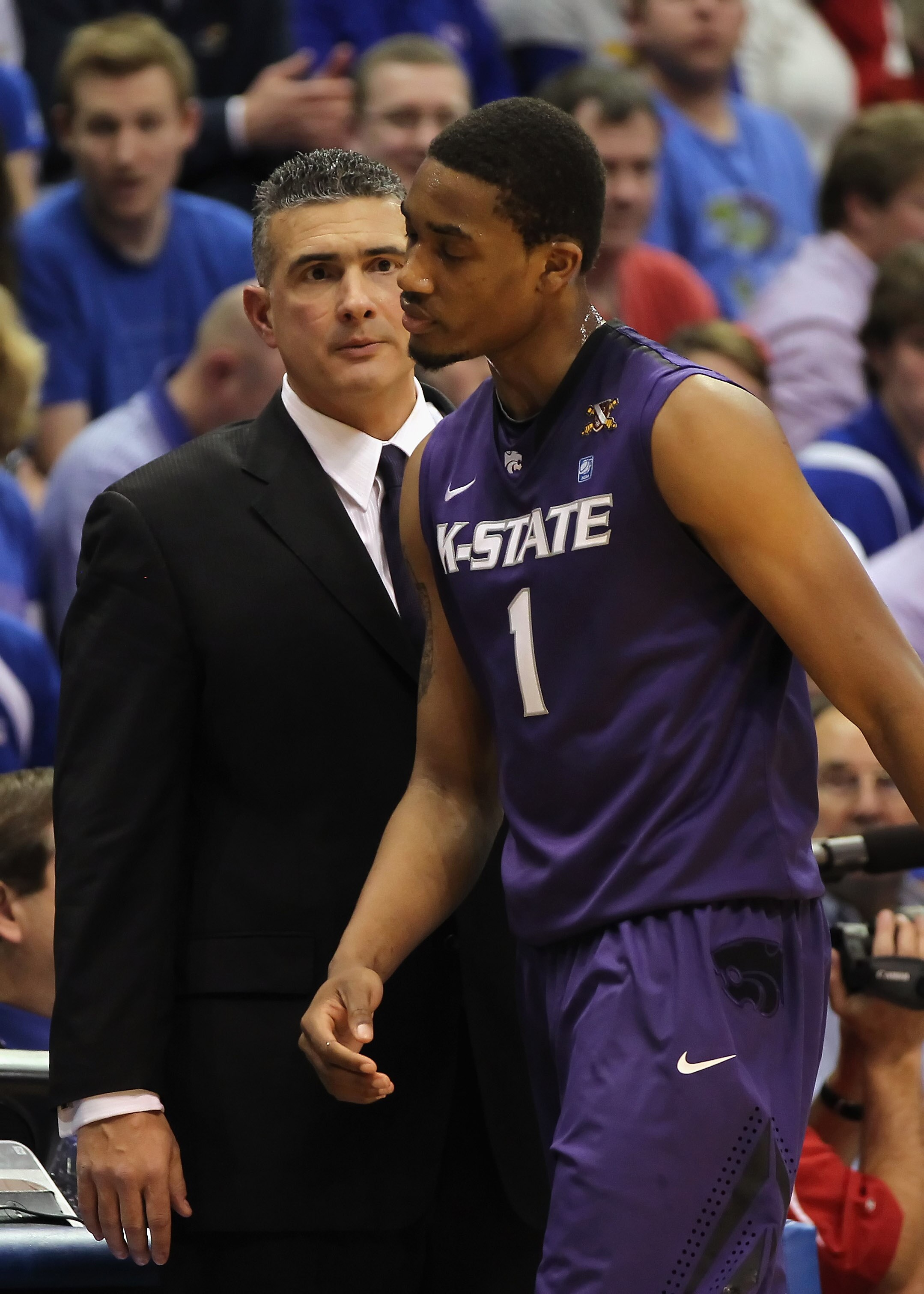 LAWRENCE, KS - JANUARY 29:  Head coach Frank Martin of the Kansas State Wildcats glares at Shane Southwell #1 during the game against the Kansas Jayhawks on January 29, 2011 at Allen Fieldhouse in Lawrence, Kansas.  (Photo by Jamie Squire/Getty Images)