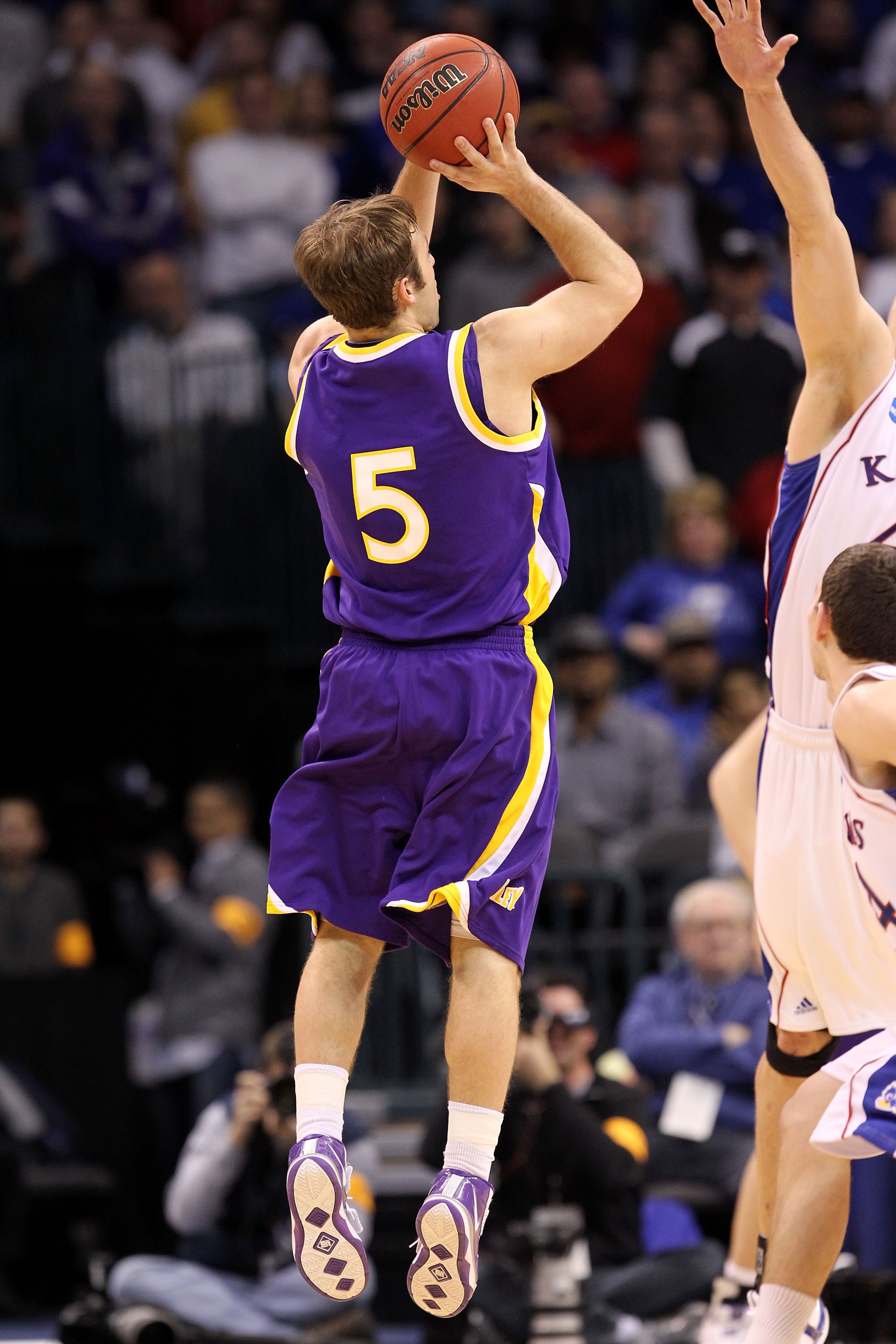 OKLAHOMA CITY - MARCH 20:  Ali Farokhmanesh #5 the Northern Iowa Panthers attempts a shot against the Kansas Jayhawks during the second round of the 2010 NCAA men's basketball tournament at Ford Center on March 20, 2010 in Oklahoma City, Oklahoma.  (Photo