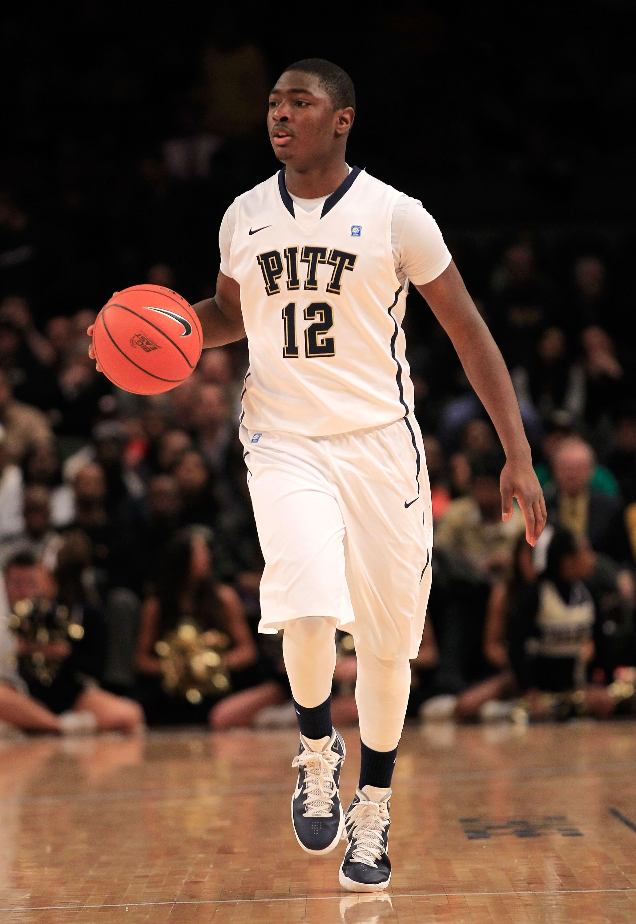 NEW YORK, NY - MARCH 10:  Ashton Gibbs #12 of the Pittsburgh Panthers brings the ball up court against the Connecticut Huskies during the quarterfinals of the 2011 Big East Men's Basketball Tournament presented by American Eagle Outfitters  at Madison Squ