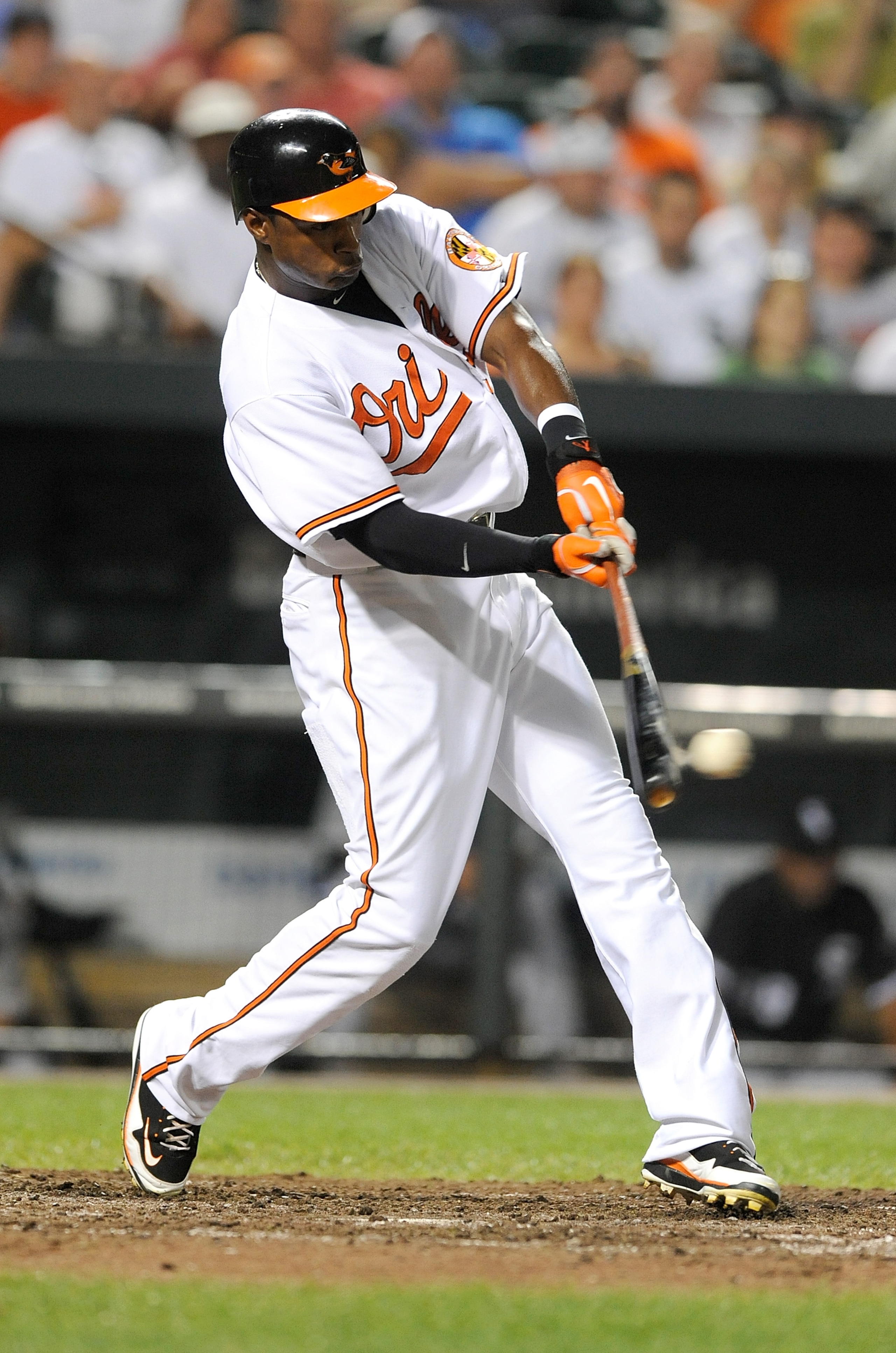 BALTIMORE - AUGUST 09:  Adam Jones #10 of the Baltimore Orioles hits a single in the eighth inning against the Chicago White Sox at Camden Yards on August 9, 2010 in Baltimore, Maryland.  (Photo by Greg Fiume/Getty Images)
