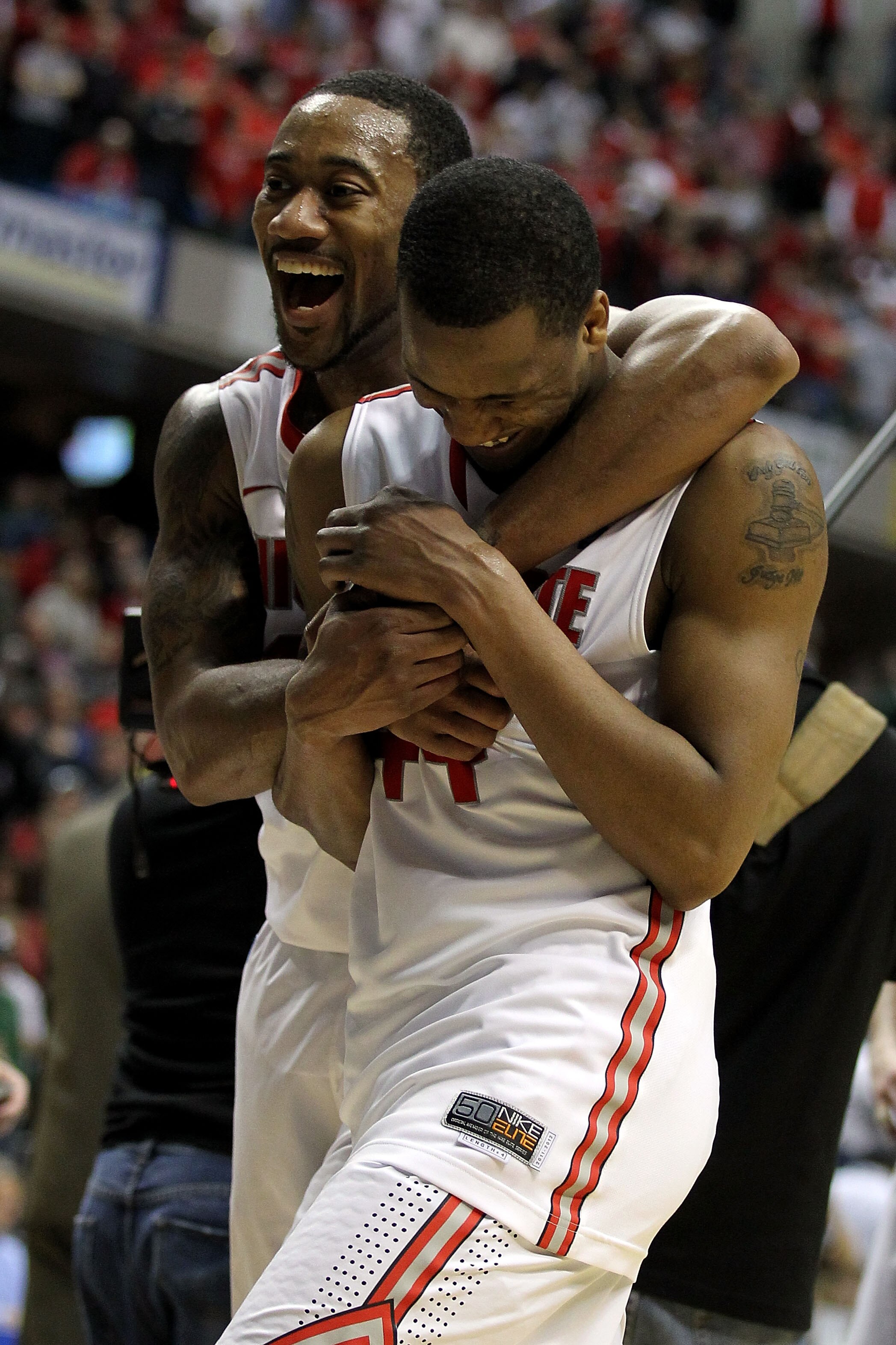 INDIANAPOLIS, IN - MARCH 12:  David Lighty #23 oand William Buford #44 of the Ohio State Buckeyes celebrate after they won 68-61 against the Michigan Wolverines during the semifinals of the 2011 Big Ten Men's Basketball Tournament at Conseco Fieldhouse on