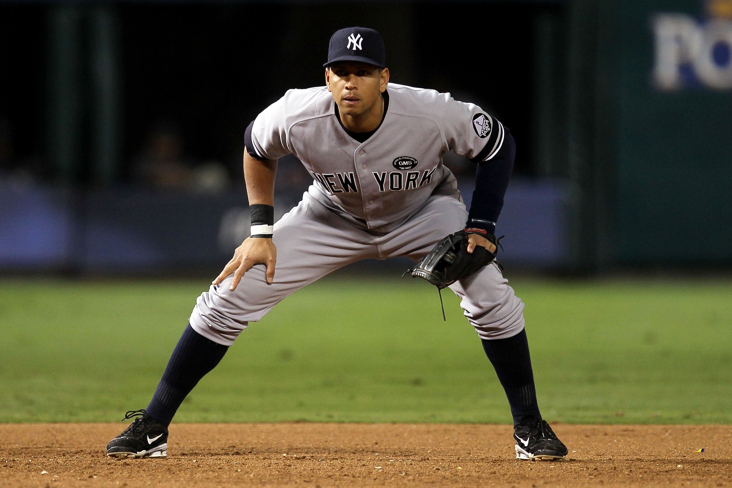 ARLINGTON, TX - OCTOBER 15:  Alex Rodriguez #13 of the New York Yankees defends third base against the Texas Rangers in Game One of the ALCS during the 2010 MLB Playoffs at Rangers Ballpark in Arlington on October 15, 2010 in Arlington, Texas. The Yankees