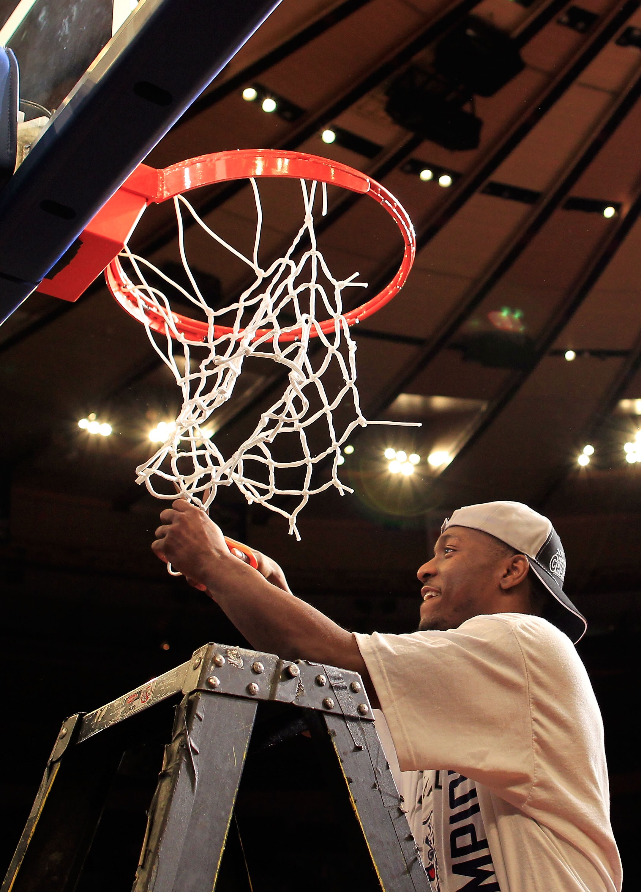 NEW YORK, NY - MARCH 12:  Kemba Walker #15 of the Connecticut Huskies cuts down the net after defeating the Louisville Cardinals during the championship of the 2011 Big East Men's Basketball Tournament presented by American Eagle Outfitters at Madison Squ