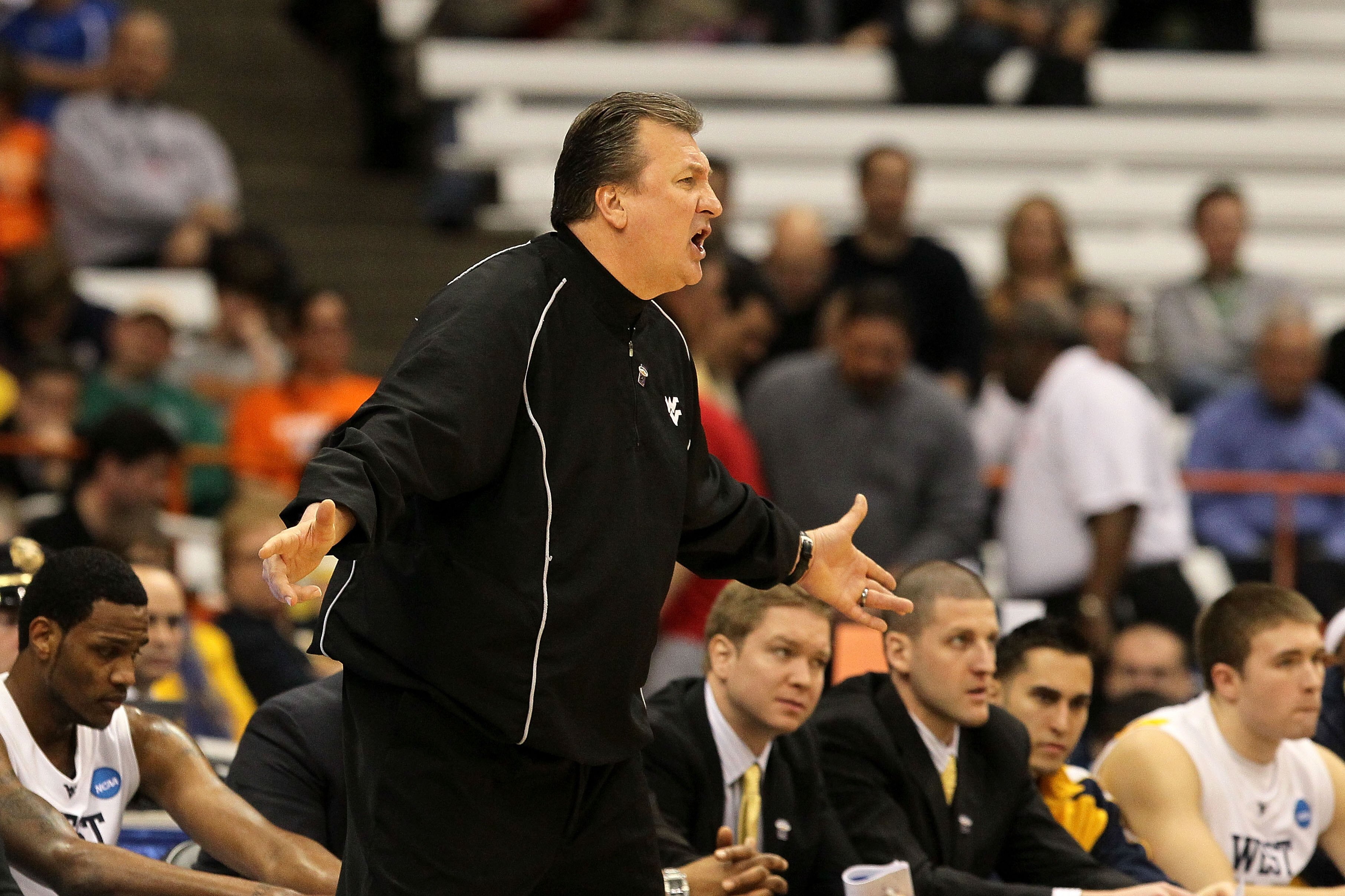 SYRACUSE, NY - MARCH 25:  Head coach Bob Huggins of the West Virginia Mountaineers reacts as he coaches against the Washington Huskies during the east regional semifinal of the 2010 NCAA men's basketball tournament at the Carrier Dome on March 25, 2010 in