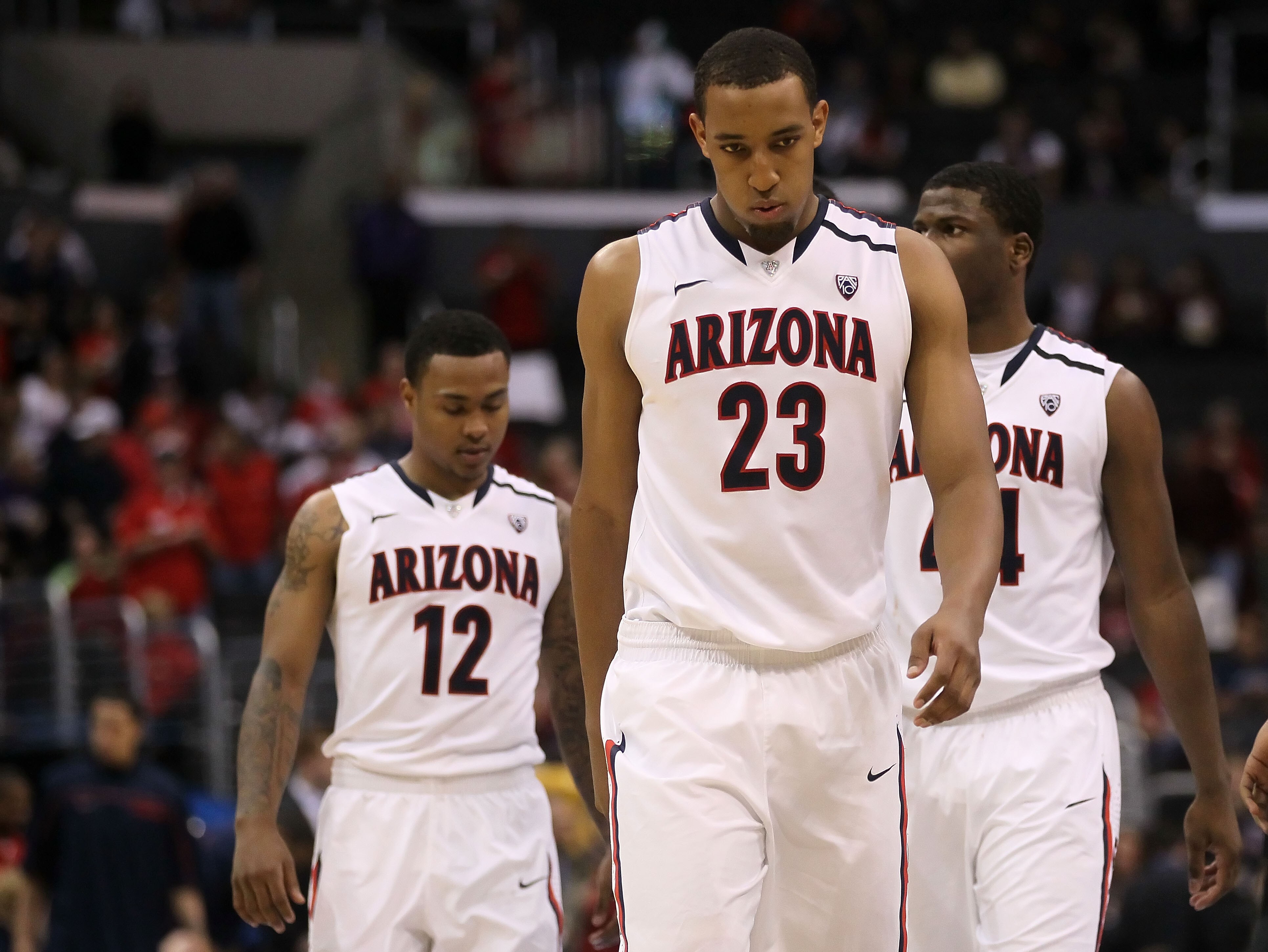 LOS ANGELES, CA - MARCH 12:  Derrick Williams #23 of the Arizona Wildcats walks ahead of teammates Lamont Jones #12 and Solomon Hill #44 while taking on the Washington Huskies in the championship game of the 2011 Pacific Life Pac-10 Men's Basketball Tourn