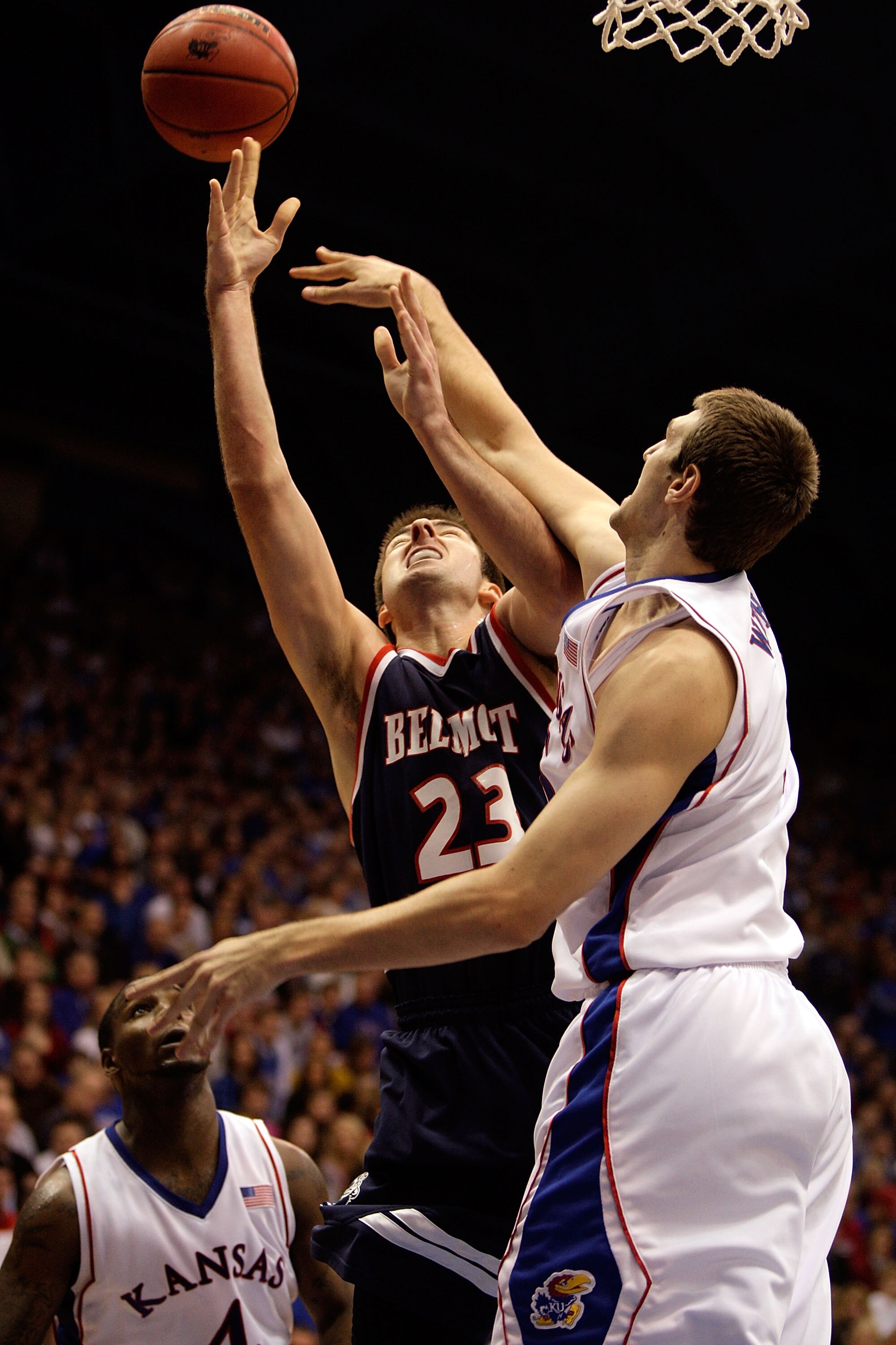 LAWRENCE, KS - DECEMBER 29:  Scott Saunders #23 of the Belmont Bruins is fouled by Jeff Withey #5 of the Kansas Jayhawks during the game on December 29, 2009 at Allen Fieldhouse in Lawrence, Kansas.  (Photo by Jamie Squire/Getty Images)