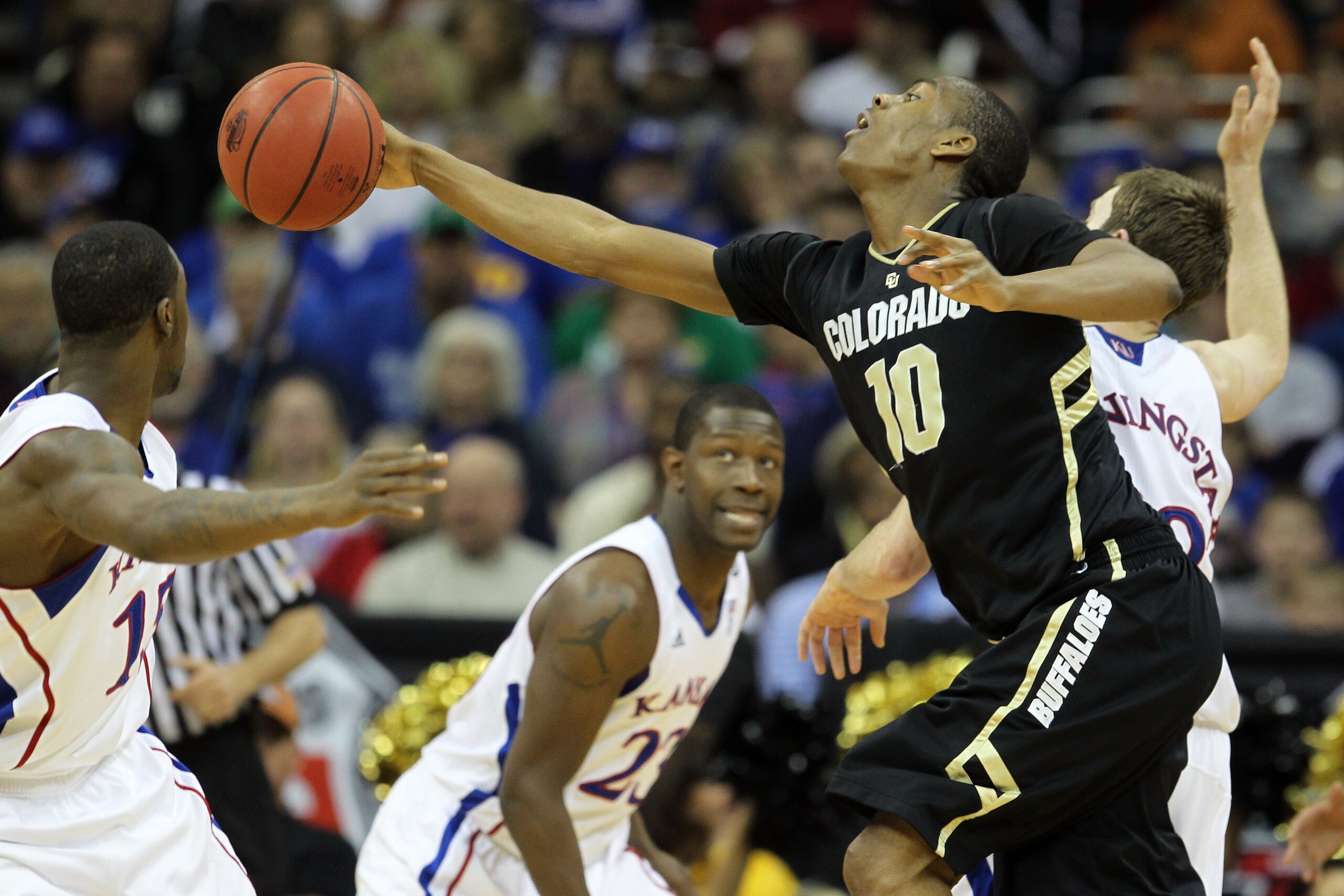 KANSAS CITY, MO - MARCH 11: Alec Burks #10 of the Colorado Buffaloes reaches for the ball during their semifinal game against the Kansas Jayhawks in the 2011 Phillips 66 Big 12 Men's Basketball Tournament at Sprint Center on March 11, 2011 in Kansas City KANSAS CITY, MO - MARCH 11: Alec Burks #10 of the Colorado Buffaloes reaches for the ball during their semifinal game against the Kansas Jayhawks in the 2011 Phillips 66 Big 12 Men's Basketball Tournament at Sprint Center on March 11, 2011 in Kansas City