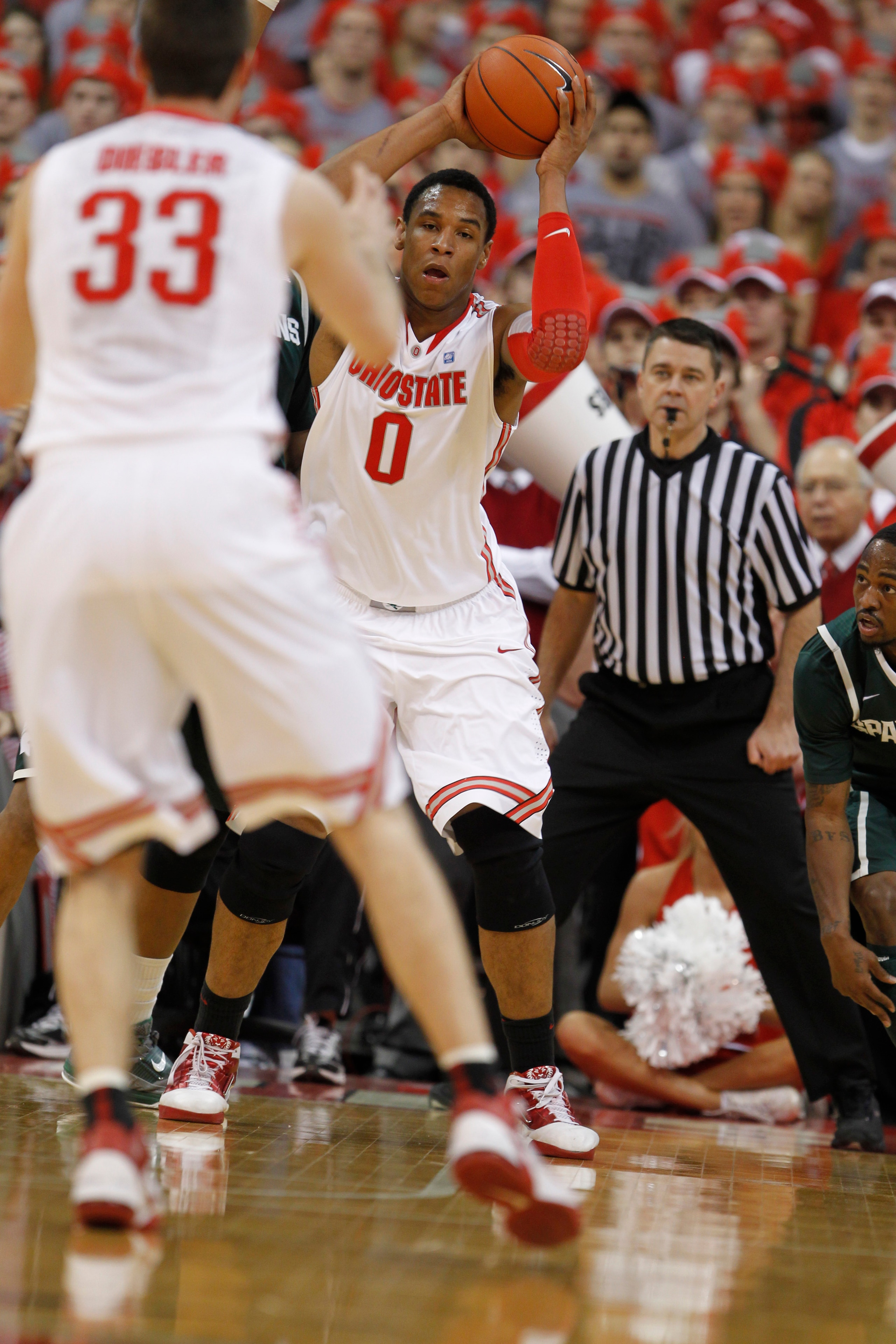 COLUMBUS, OH - FEBRUARY 15:  Jared Sullinger #0 of the Ohio State Buckeyes passes to Jon Diebler #33 while playing the Michigan State Spartans on February 15, 2011 at Value City Arena in Columbus, Ohio.  (Photo by Gregory Shamus/Getty Images)