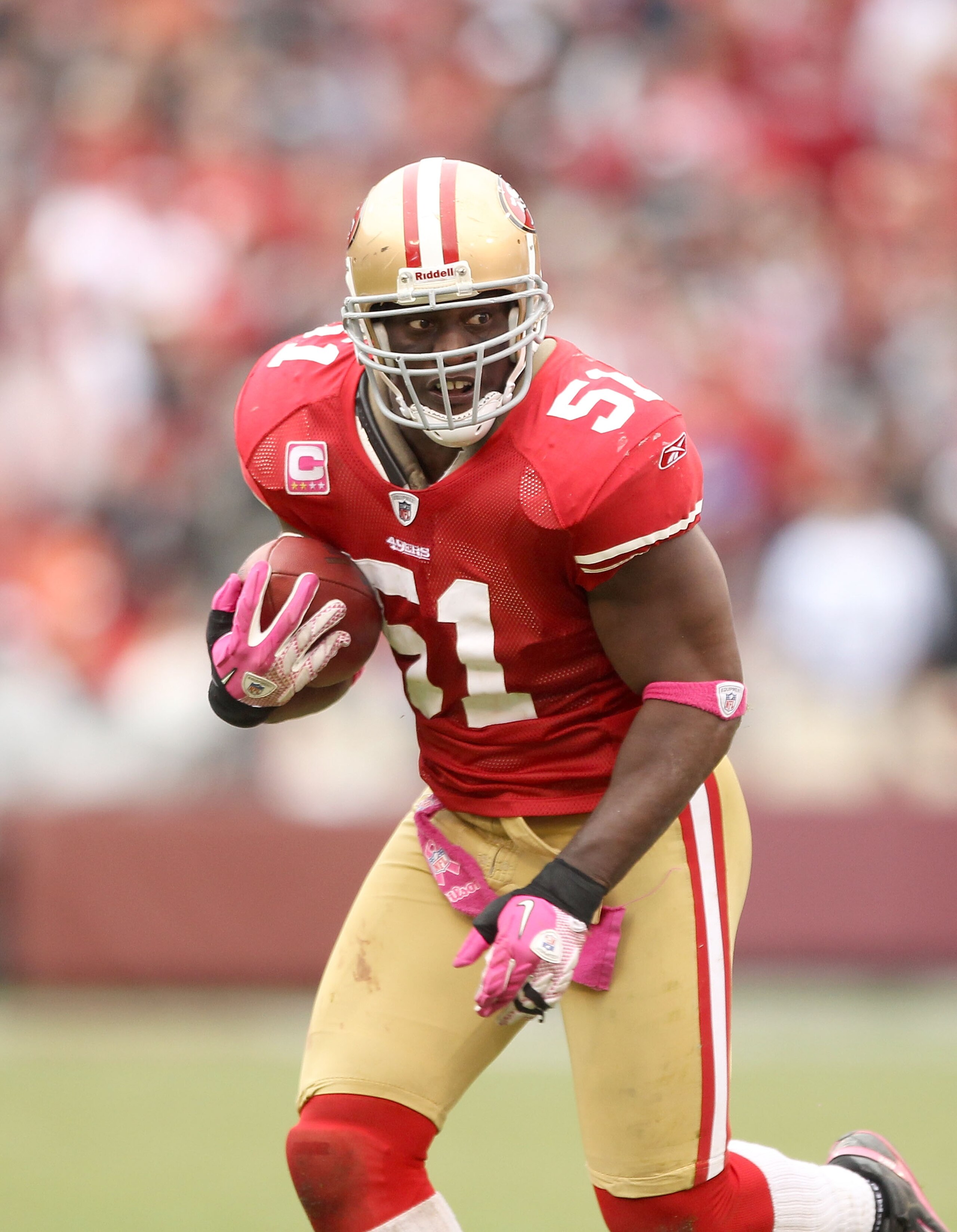 SAN FRANCISCO - OCTOBER 17:  Takeo Spikes #51 of the San Francisco 49ers returns an interception against the Oakland Raiders at Candlestick Park on October 17, 2010 in San Francisco, California.  (Photo by Ezra Shaw/Getty Images)