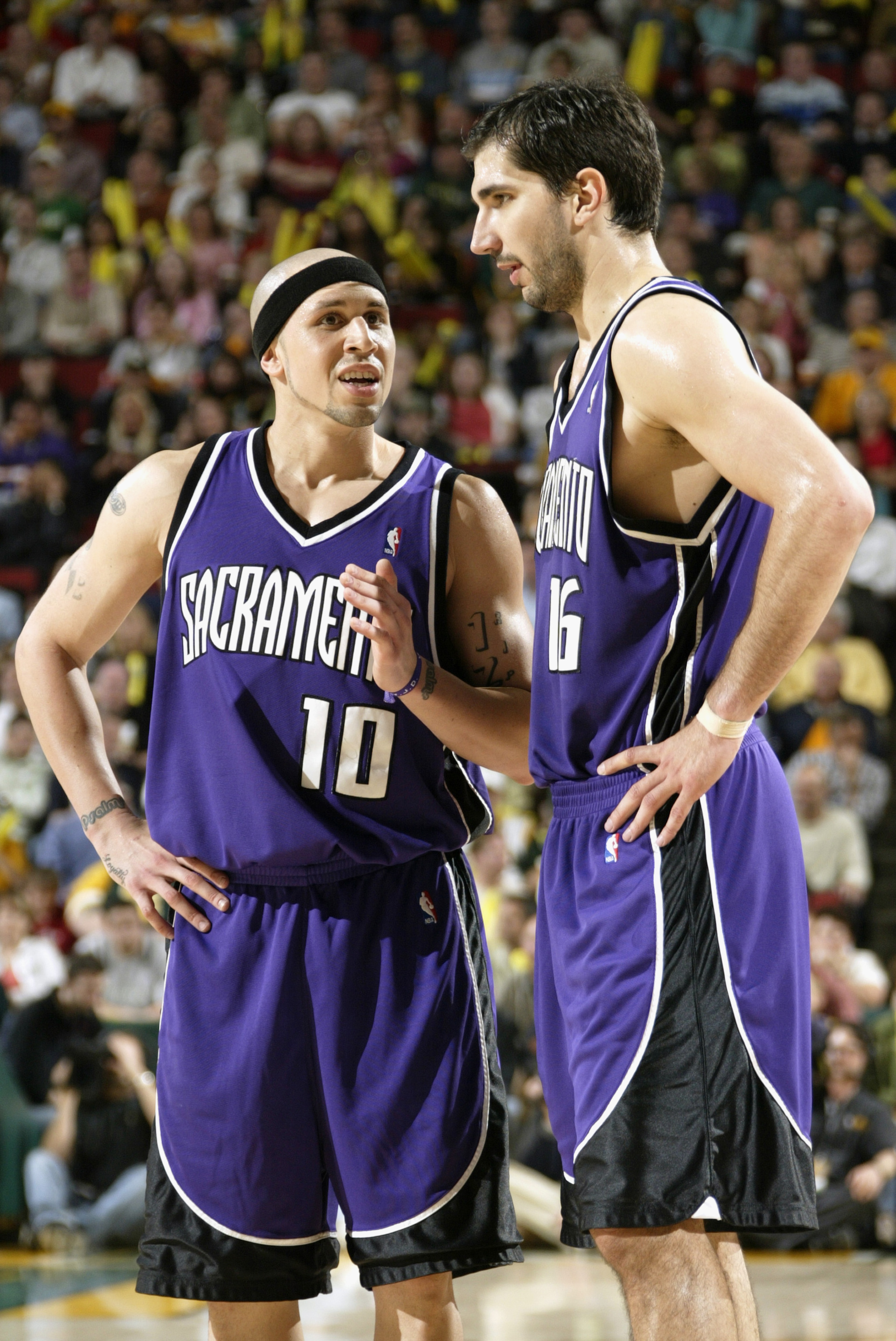 SEATTLE - MAY 3:  Mike Bibby #10 of the Sacramento Kings talks to his teammate Peja Stojakovic #16 in Game five of the Western Conference Quarterfinals against the Seattle Sonics during the 2005 NBA Playoffs at Key Arena on May 3, 2005 in Seattle, Washing