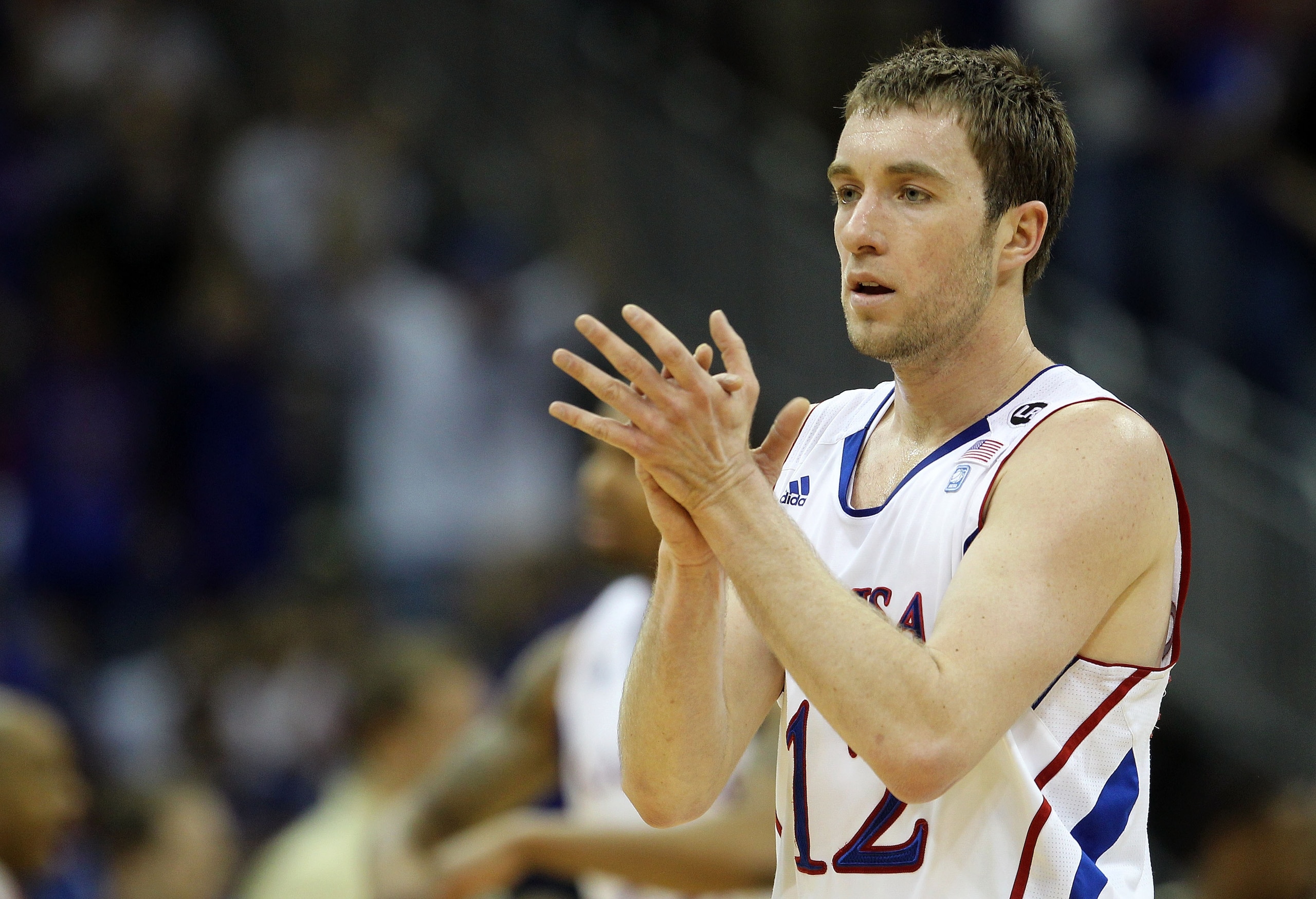 KANSAS CITY, MO - MARCH 11:  Brady Morningstar #12 of the Kansas Jayhawks reacts to a play against the Colorado Buffaloes during their semifinal game in the 2011 Phillips 66 Big 12 Men's Basketball Tournament at Sprint Center on March 11, 2011 in Kansas C
