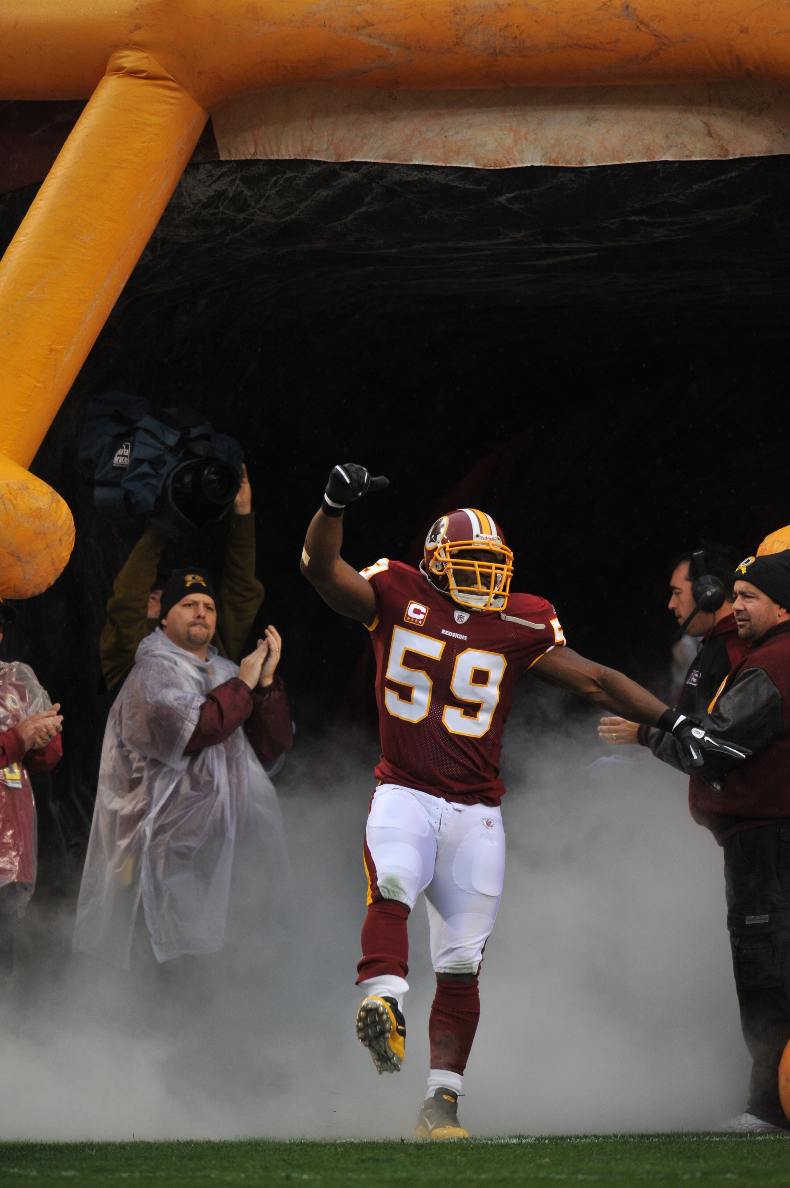 LANDOVER, MD - DECEMBER 12:  London Fletcher #59 of the Washington Redskins is introduced before the game against the Tampa Bay Buccaneers  at FedExField on December 12, 2010 in Landover, Maryland. The Buccaneers defeated the Redskins 17-16. (Photo by Lar