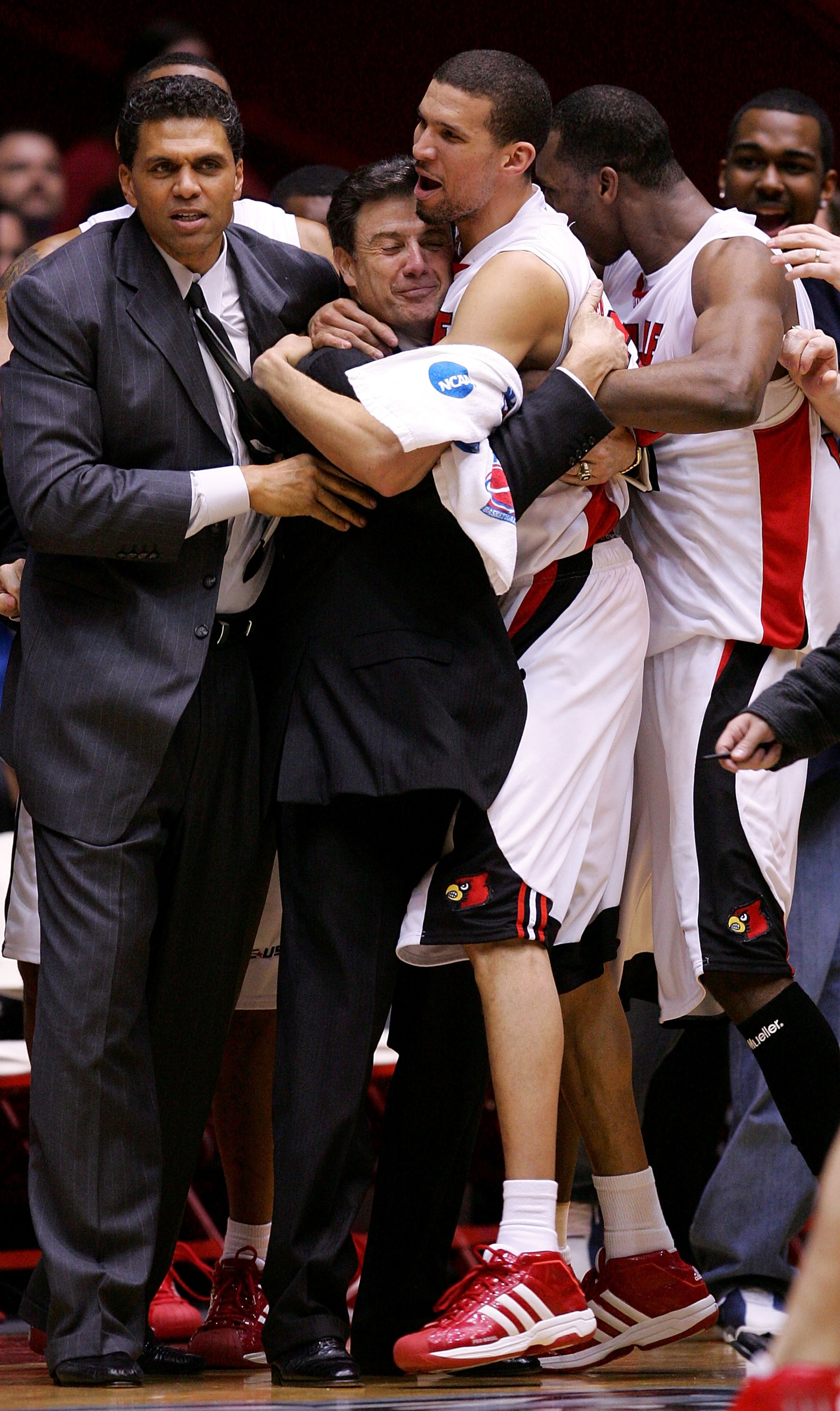 ALBUQUERQUE, NM - MARCH 26: Head coach Rick Pitino (center) is hugged by Francisco Garcia #32 of the Louisville Cardinals after the Cardinals defeated the West Virginia Mountaineers in overtime during the Elite 8 game of the NCAA Division I Men's Basketb ALBUQUERQUE, NM - MARCH 26: Head coach Rick Pitino (center) is hugged by Francisco Garcia #32 of the Louisville Cardinals after the Cardinals defeated the West Virginia Mountaineers in overtime during the Elite 8 game of the NCAA Division I Men's Basketb