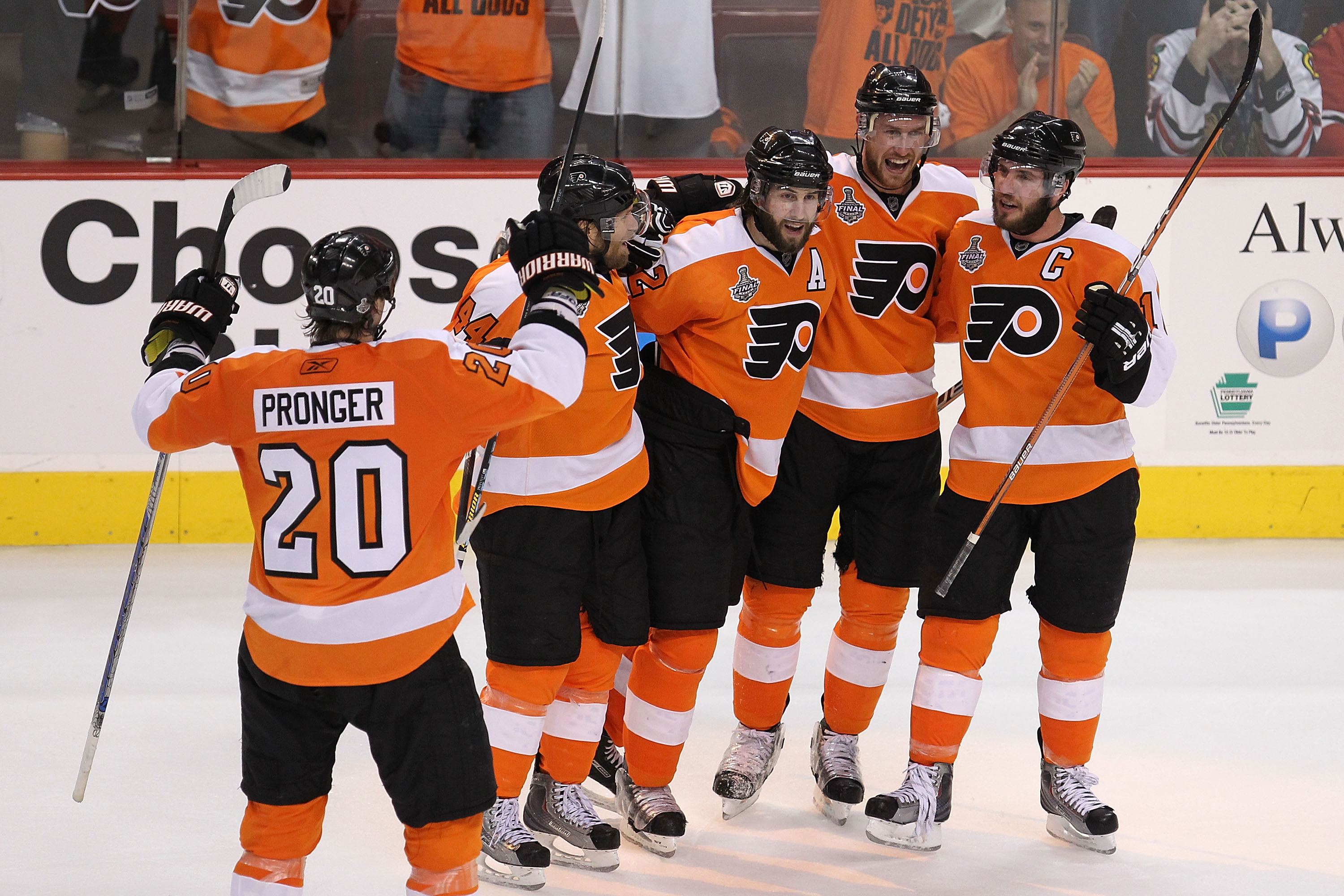 PHILADELPHIA - JUNE 04:  Jeff Carter #17 of the Philadelphia Flyers celebrates with teammates Chris Pronger #20, Kimmo Timonen #44, Simon Gagne #12 and Mike Richards #18 after scoring an empty-net goal in the third period against the Chicago Blackhawks to