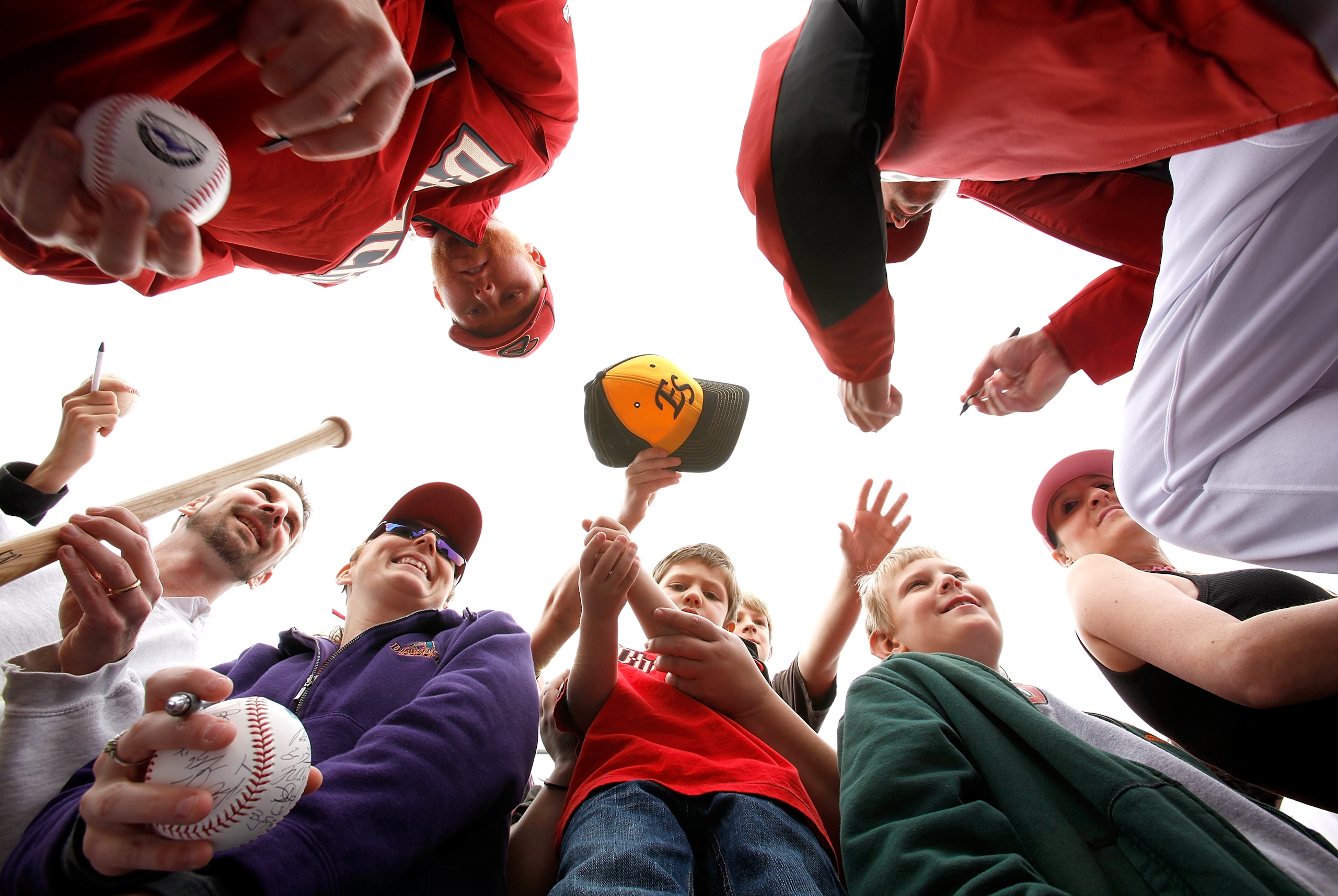 SCOTTSDALE, AZ - FEBRUARY 26:  Arizona Diamondbacks fans get autographs from players before the game between the Colorado Rockies and the Arizona Diamondbacks at Salt River Fields on February 26, 2011in Scottsdale, Arizona..  (Photo by Jonathan Ferrey/Get
