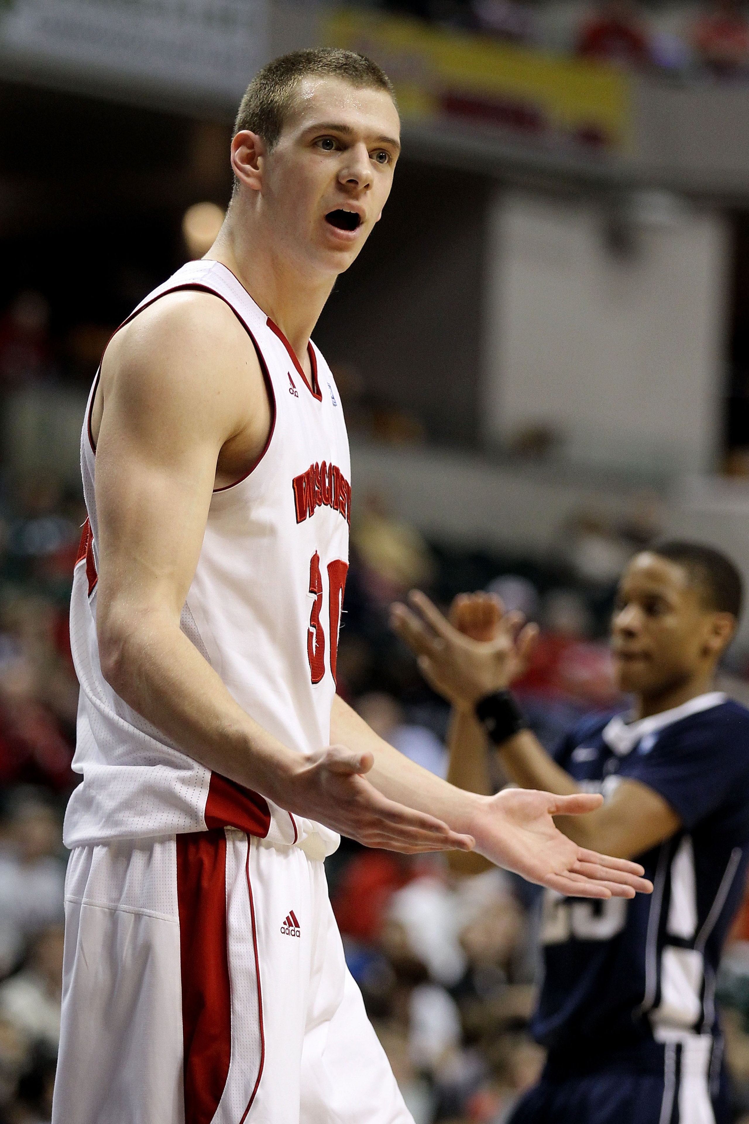 INDIANAPOLIS, IN - MARCH 11: Jon Leuer #30 of the Wisconsin Badgers reacts against the Penn State Nittany Lions during the quarterfinals of the 2011 Big Ten Men's Basketball Tournament at Conseco Fieldhouse on March 11, 2011 in Indianapolis, Indiana. Pen INDIANAPOLIS, IN - MARCH 11: Jon Leuer #30 of the Wisconsin Badgers reacts against the Penn State Nittany Lions during the quarterfinals of the 2011 Big Ten Men's Basketball Tournament at Conseco Fieldhouse on March 11, 2011 in Indianapolis, Indiana. Pen