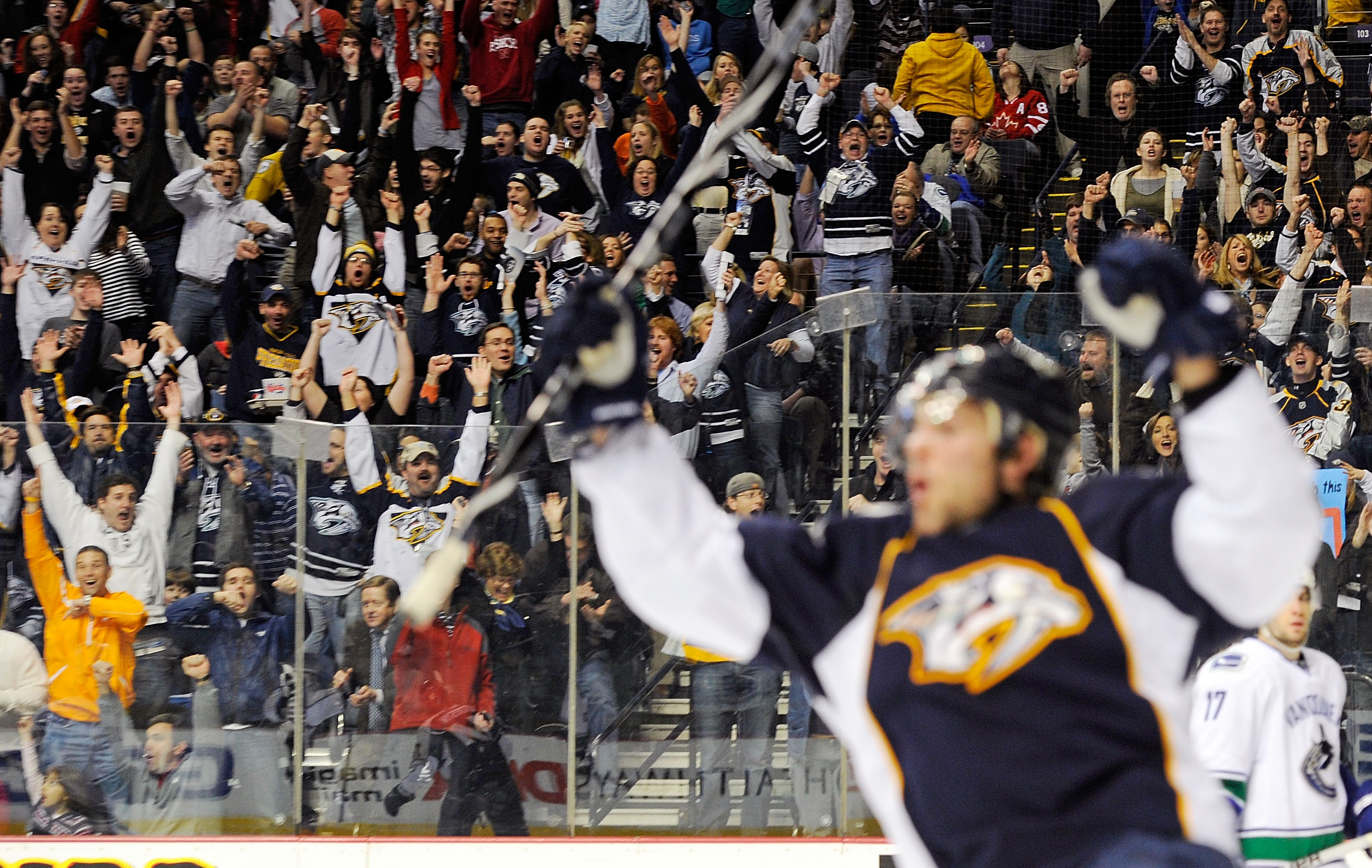 NASHVILLE, TN - FEBRUARY 17:  Fans celebrate after a goal is scored by Mike Fisher of the Nashville Predators on February 17, 2011 at the Bridgestone Arena in Nashville, Tennessee.  (Photo by Frederick Breedon/Getty Images)