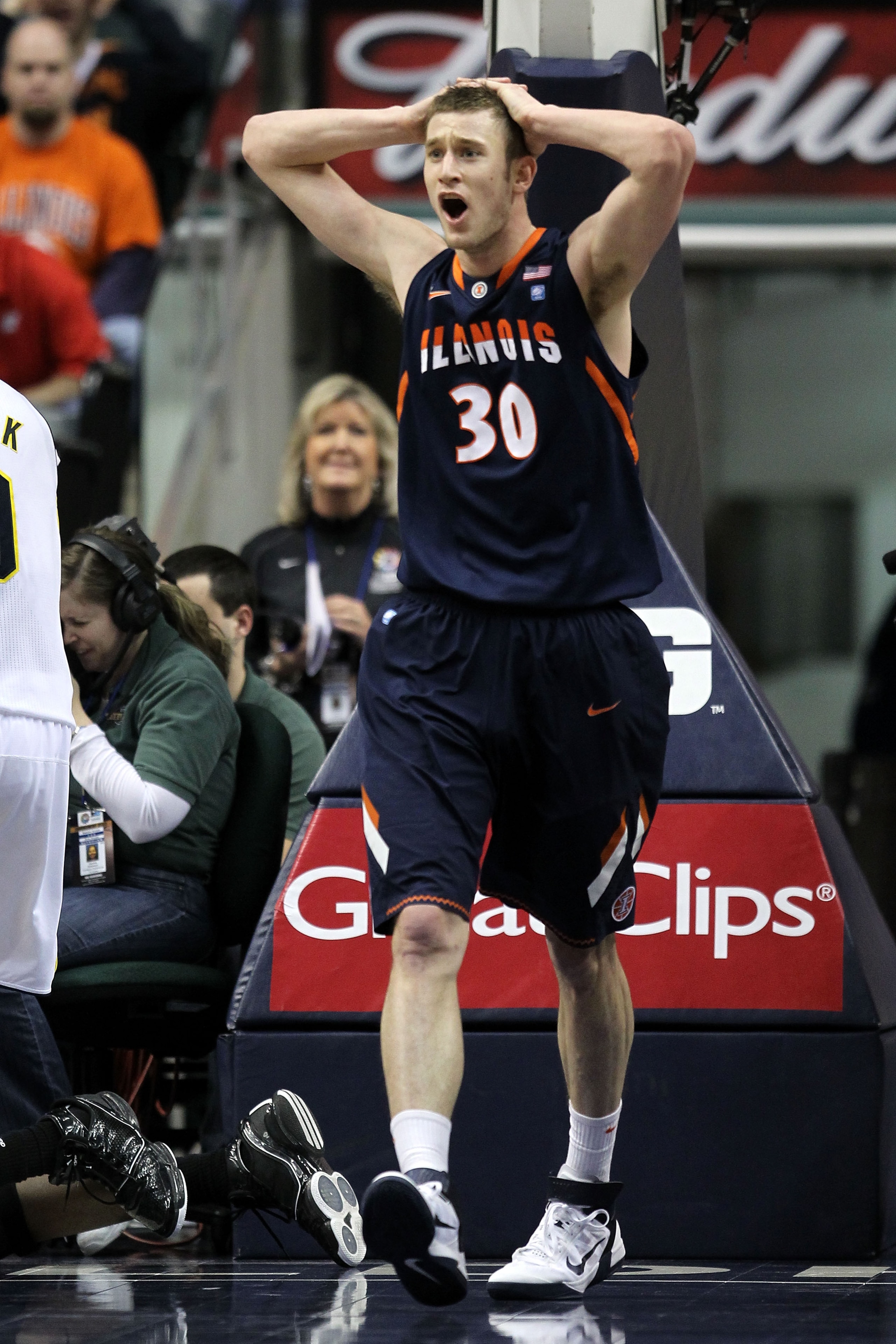INDIANAPOLIS, IN - MARCH 11:  Bill Cole #30 of the Illinois Fighting Illini reacts after he fouled out in the second half against the Michigan Wolverines during the quarterfinals of the 2011 Big Ten Men's Basketball Tournament at Conseco Fieldhouse on Mar