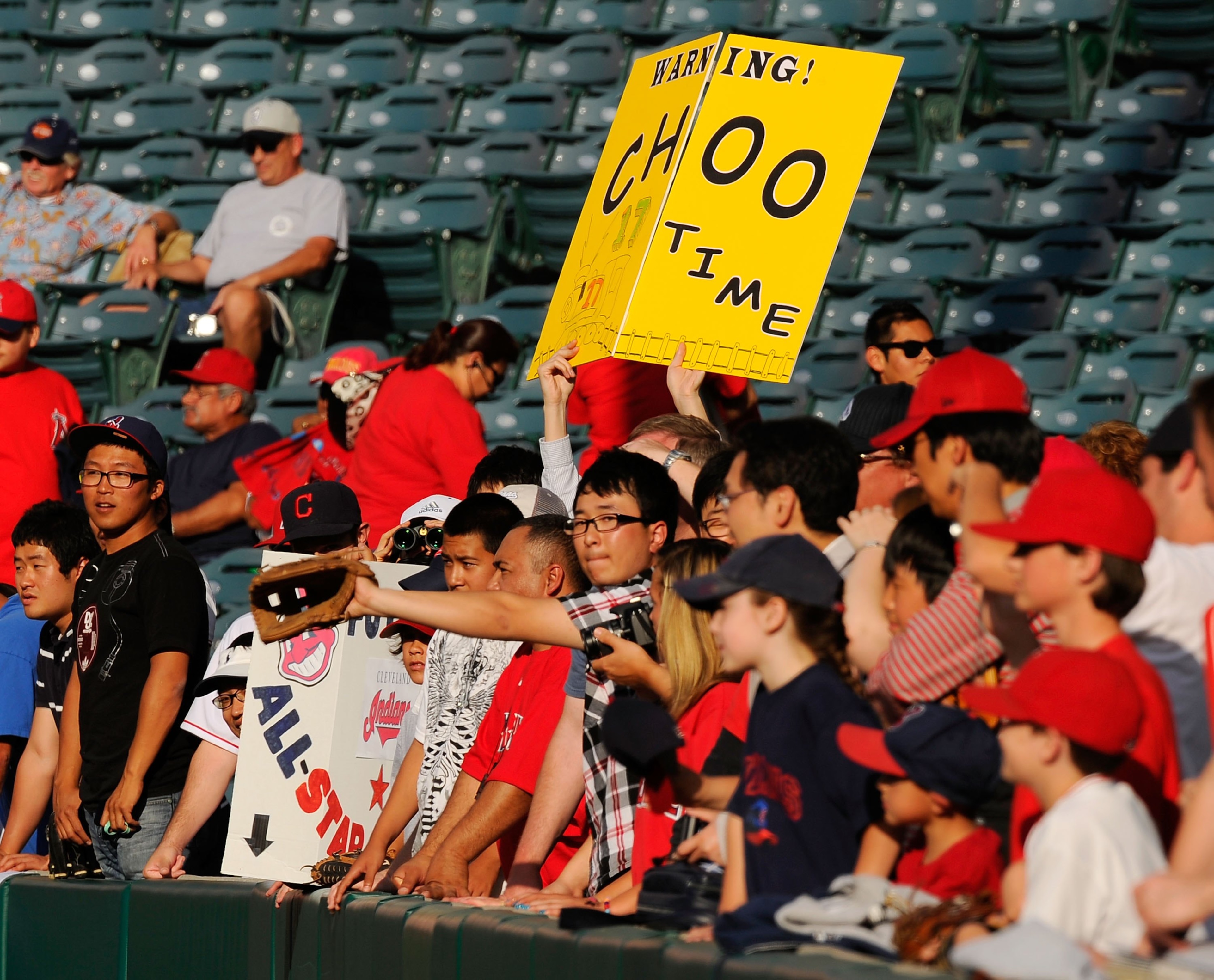 ANAHEIM, CA - APRIL 26: Fans in support of Shin-Soo Choo #17 Korean right fielder of the Cleveland Indians hold up signs during batting practice before the start of the baseball game against Los Angeles Angels of Anaheim on April 26, 2010 at Angel Stadiu ANAHEIM, CA - APRIL 26: Fans in support of Shin-Soo Choo #17 Korean right fielder of the Cleveland Indians hold up signs during batting practice before the start of the baseball game against Los Angeles Angels of Anaheim on April 26, 2010 at Angel Stadiu