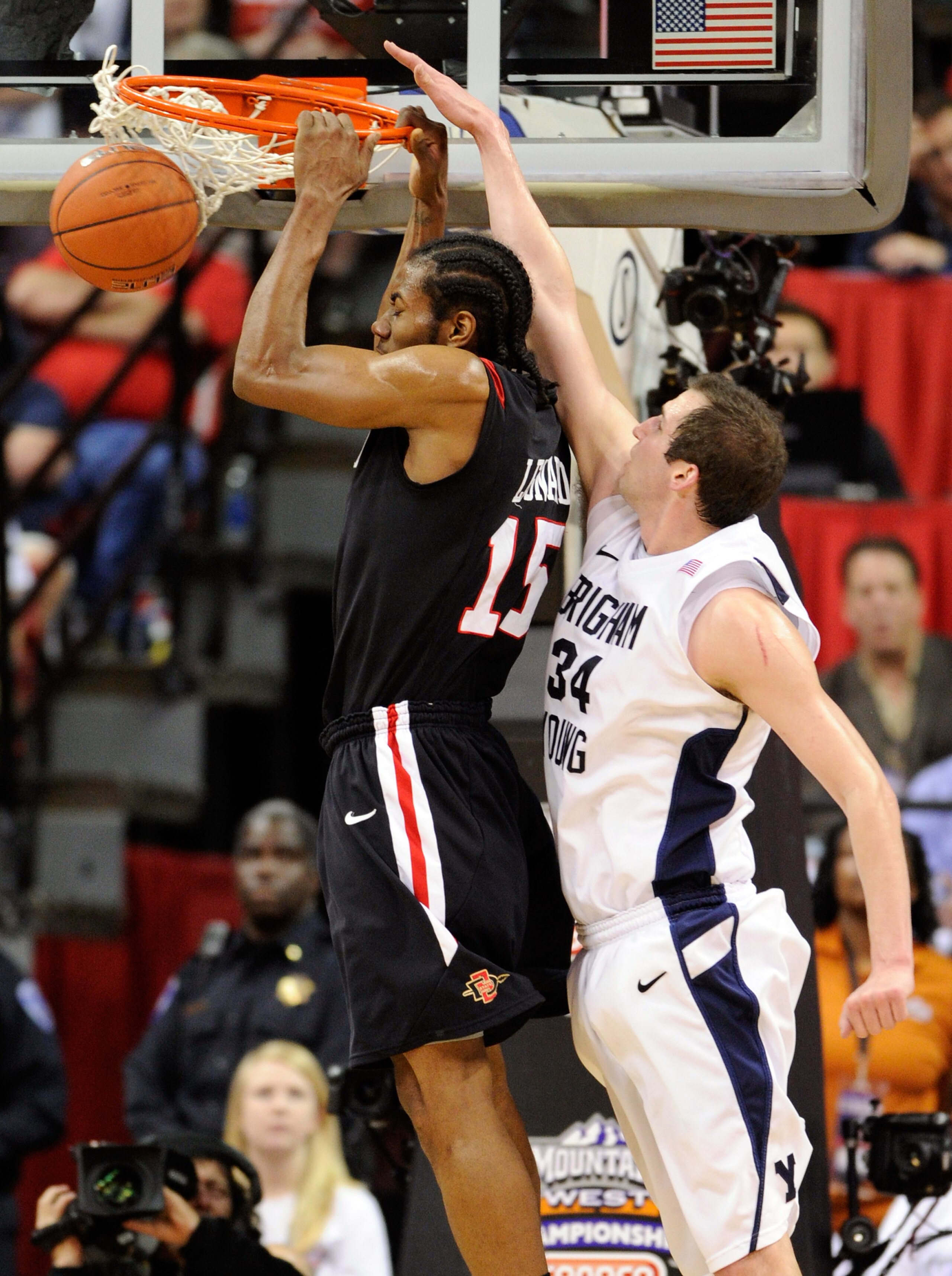 LAS VEGAS, NV - MARCH 12: Kawhi Leonard #15 of the San Diego State Aztecs dunks in front of Noah Hartsock #34 of the Brigham Young University Cougars during the championship game of the Conoco Mountain West Conference Basketball tournament at the Thomas LAS VEGAS, NV - MARCH 12: Kawhi Leonard #15 of the San Diego State Aztecs dunks in front of Noah Hartsock #34 of the Brigham Young University Cougars during the championship game of the Conoco Mountain West Conference Basketball tournament at the Thomas
