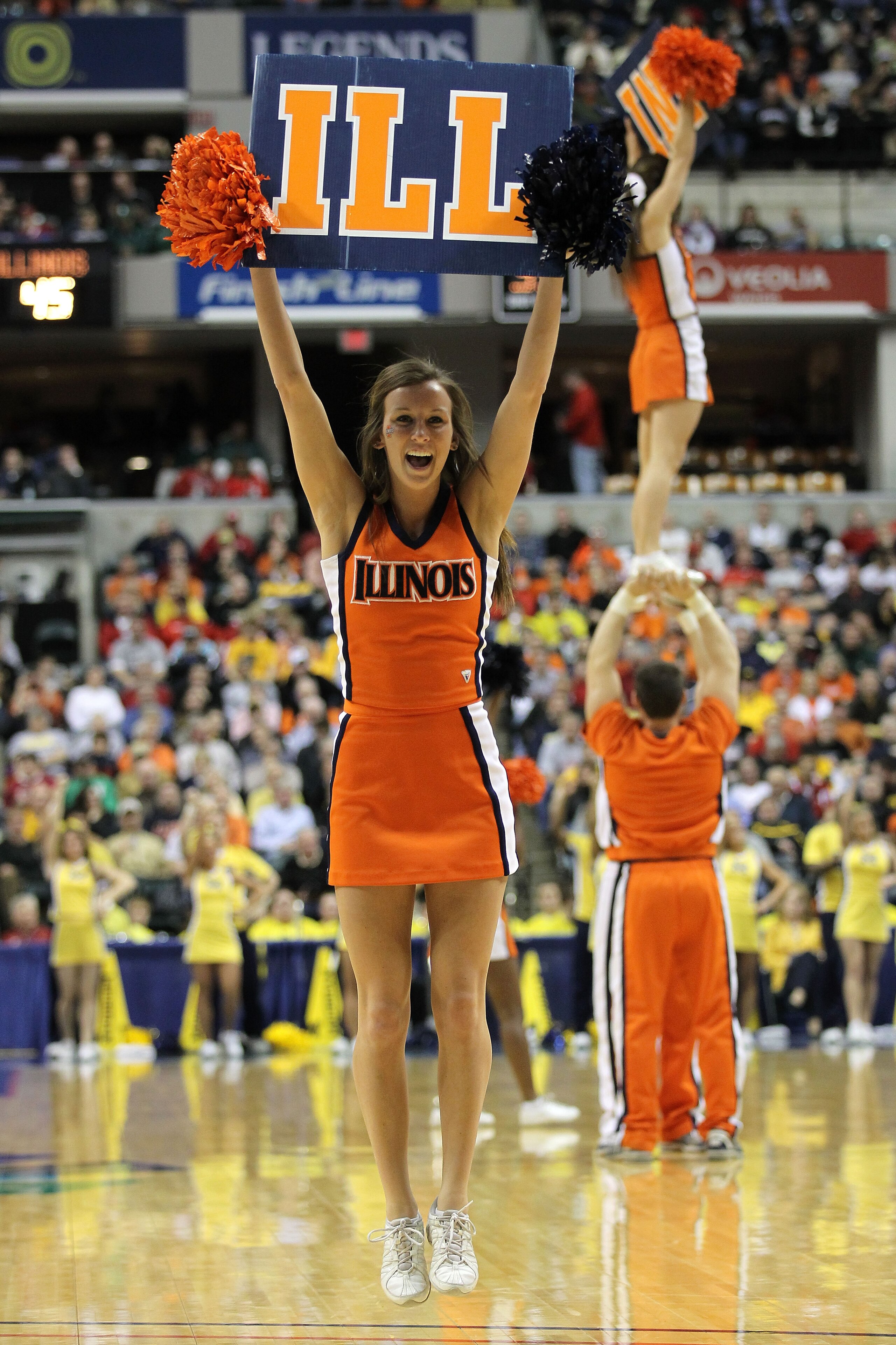INDIANAPOLIS, IN - MARCH 11:  Cheerleaders for the Illinois Fighting Illini perform against the Michigan Wolverines during the quarterfinals of the 2011 Big Ten Men's Basketball Tournament at Conseco Fieldhouse on March 11, 2011 in Indianapolis, Indiana.