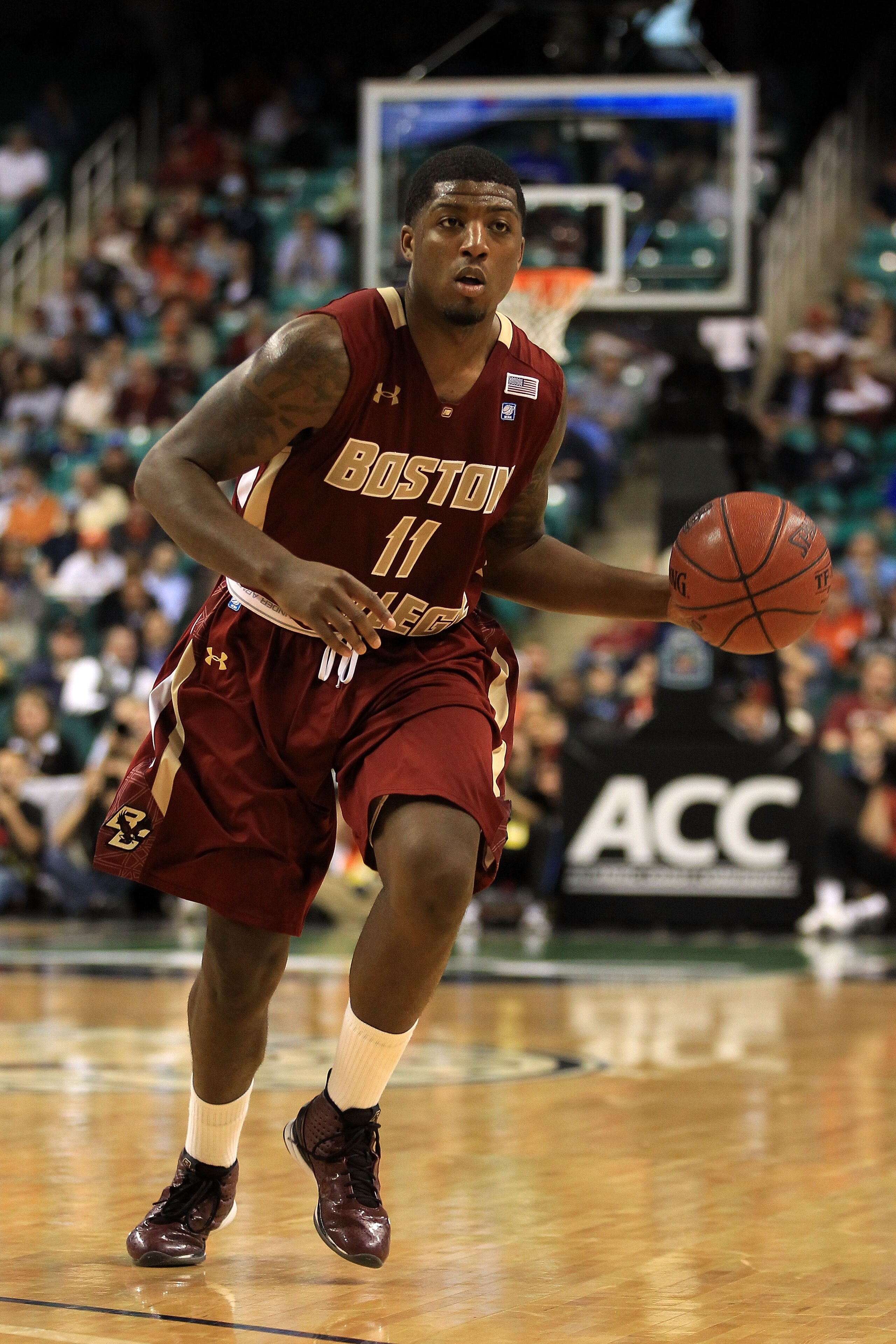 GREENSBORO, NC - MARCH 11:  Corey Raji #11 of the Boston College Eagles moves the ball against the Clemson Tigers during the second half in the quarterfinals of the 2011 ACC men's basketball tournament at the Greensboro Coliseum on March 11, 2011 in Green
