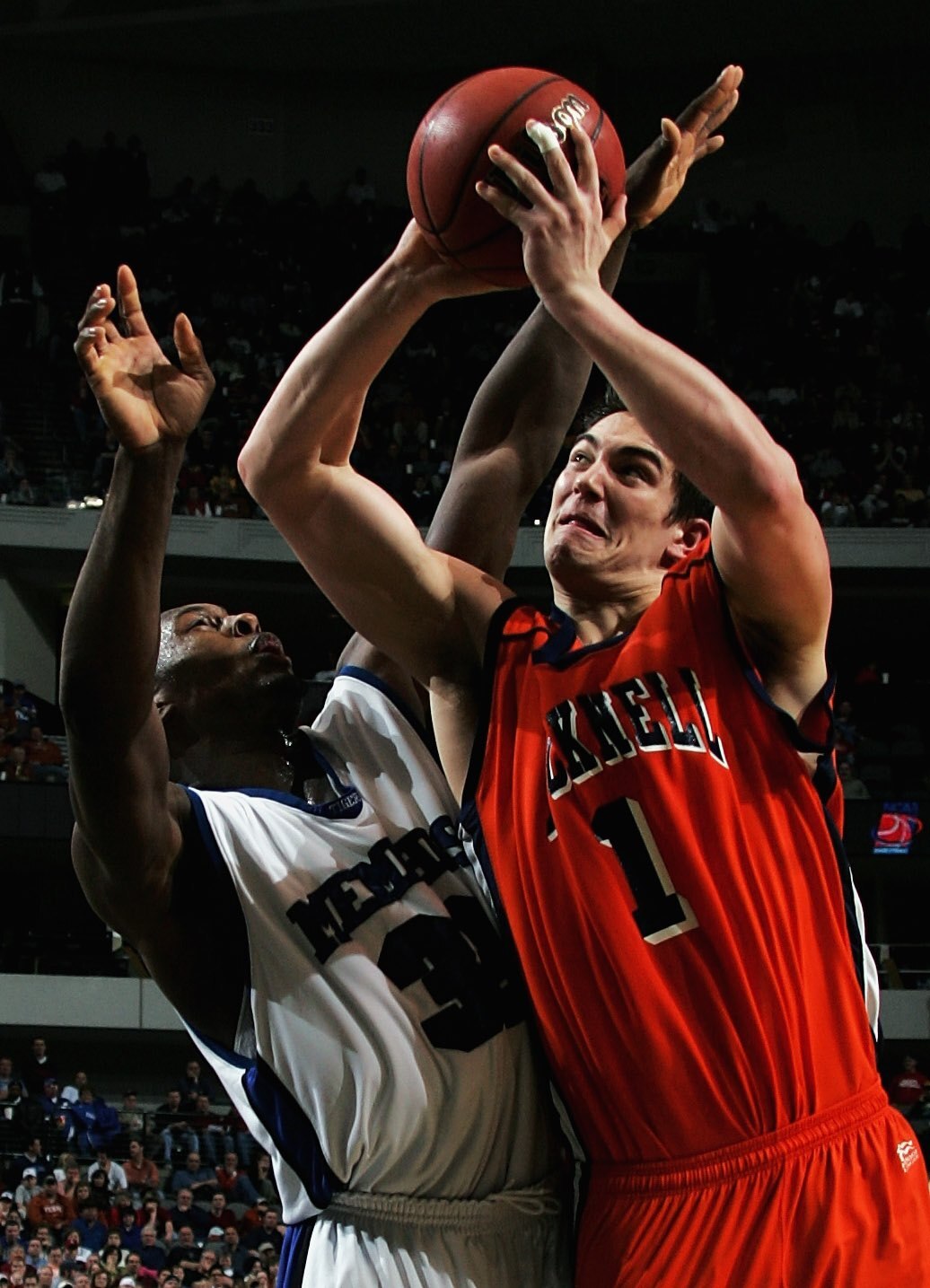 DALLAS, TEXAS - MARCH 19:  Darren Mastropaolo #1 of the Bucknell Bison goes up for a shot against Darius Washington Jr. #35 of the Memphis Tigers during the Second Round game of the 2006 NCAA Division 1 Men's Basketball Championship Tournament on March 19
