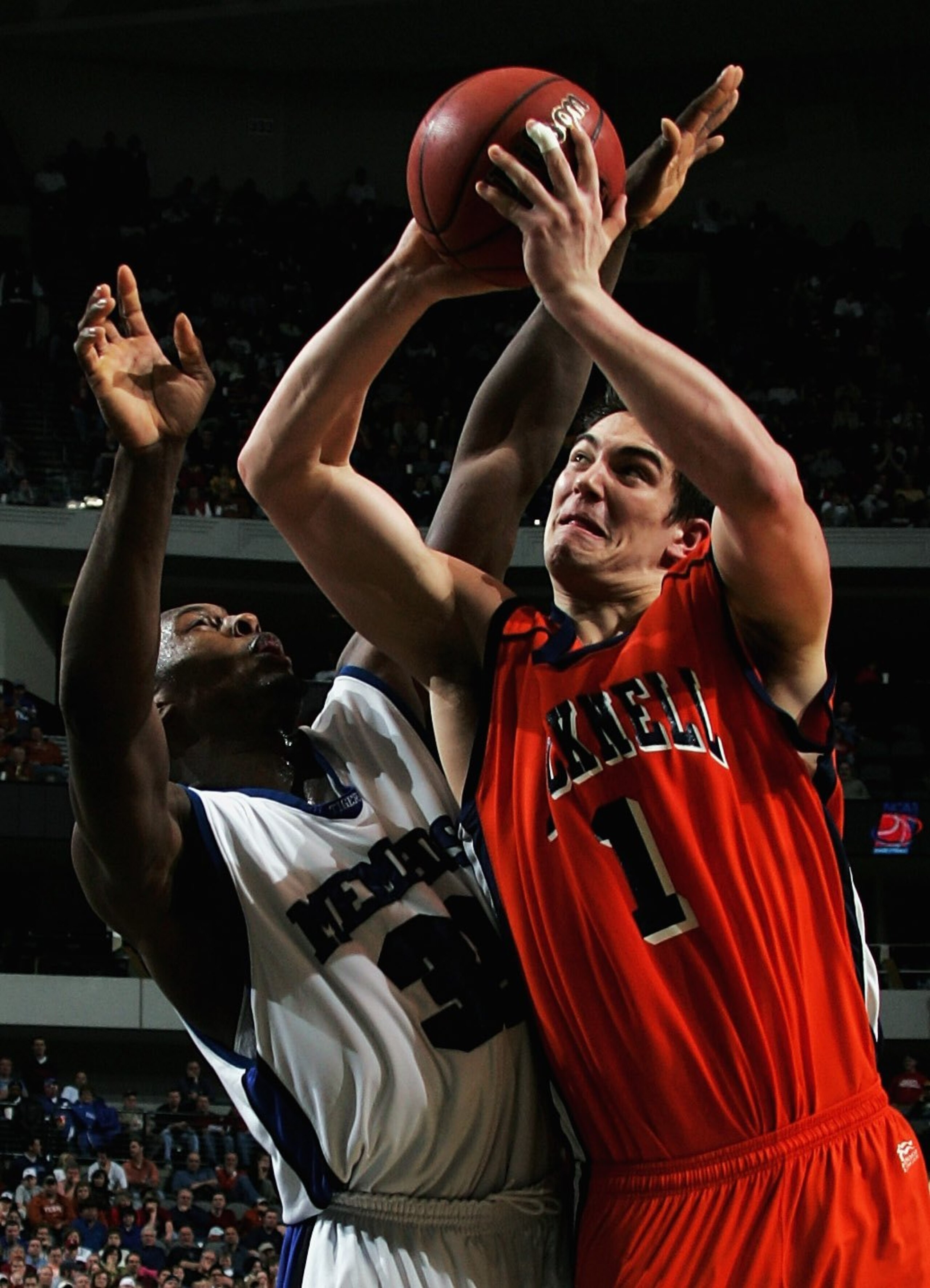 DALLAS, TEXAS - MARCH 19:  Darren Mastropaolo #1 of the Bucknell Bison goes up for a shot against Darius Washington Jr. #35 of the Memphis Tigers during the Second Round game of the 2006 NCAA Division 1 Men's Basketball Championship Tournament on March 19