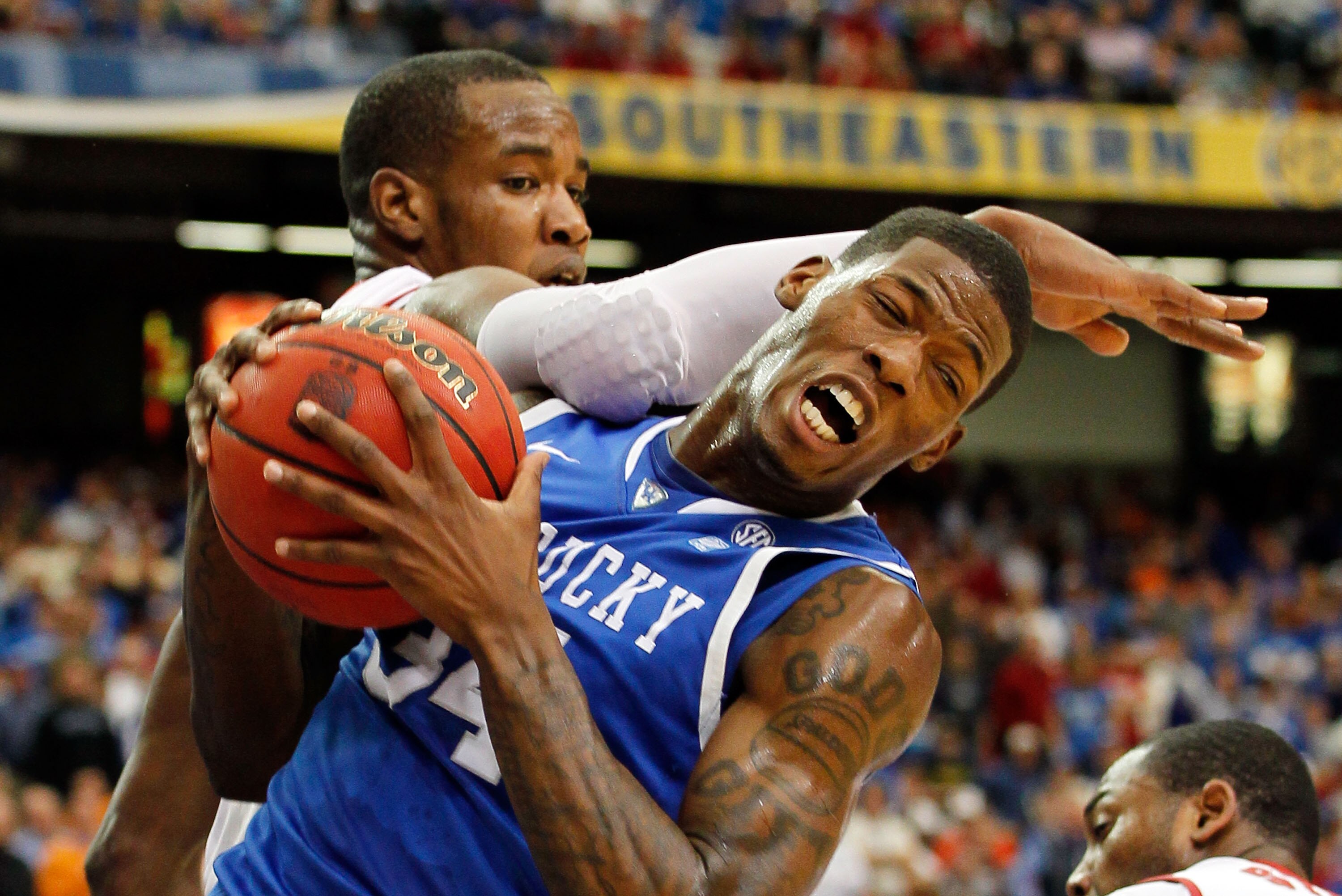 ATLANTA, GA - MARCH 12:  Chris Hines #44 of the Alabama Crimson Tide comes down on DeAndre Liggins #34 of the Kentucky Wildcats as he grabs a rebound during the semifinals of the SEC Men's Basketball Tournament at Georgia Dome on March 12, 2011 in Atlanta