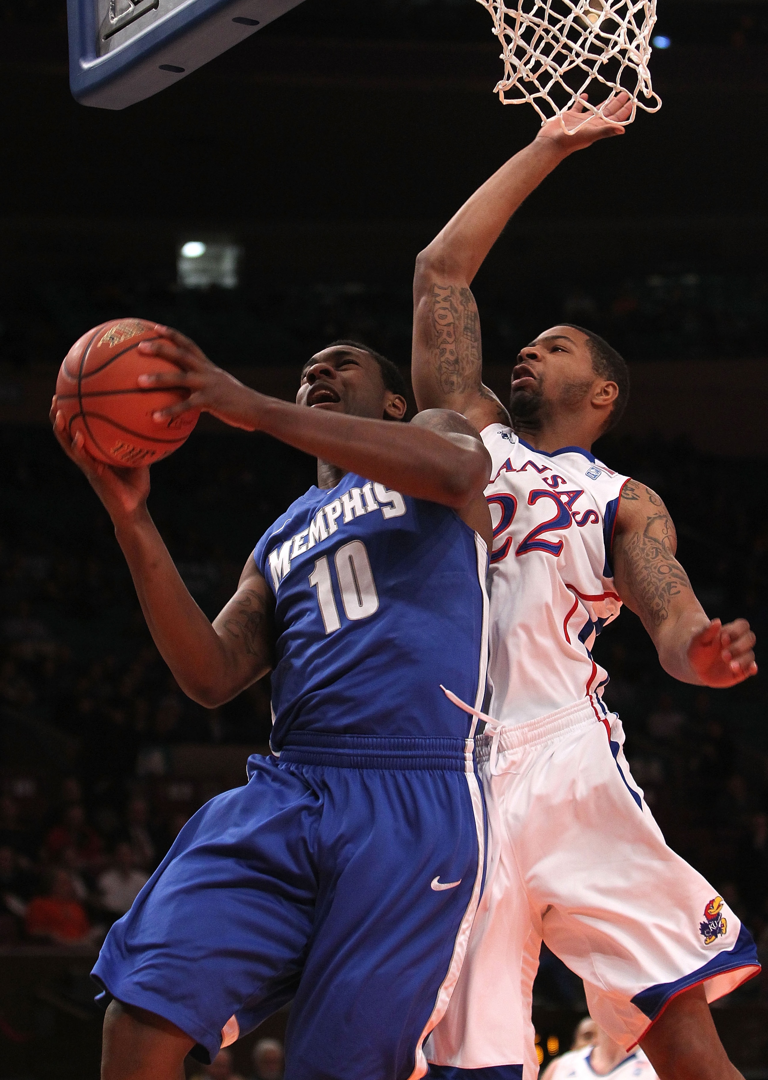 NEW YORK, NY - DECEMBER 07:  Tarik Black #10 of the Memphis Tigers shoots the ball against Marcus Morris #22 of the Kansas Jayhawks during their game at the Jimmy V Classic at Madison Square Garden on December 7, 2010 in New York City.  (Photo by Nick Lah