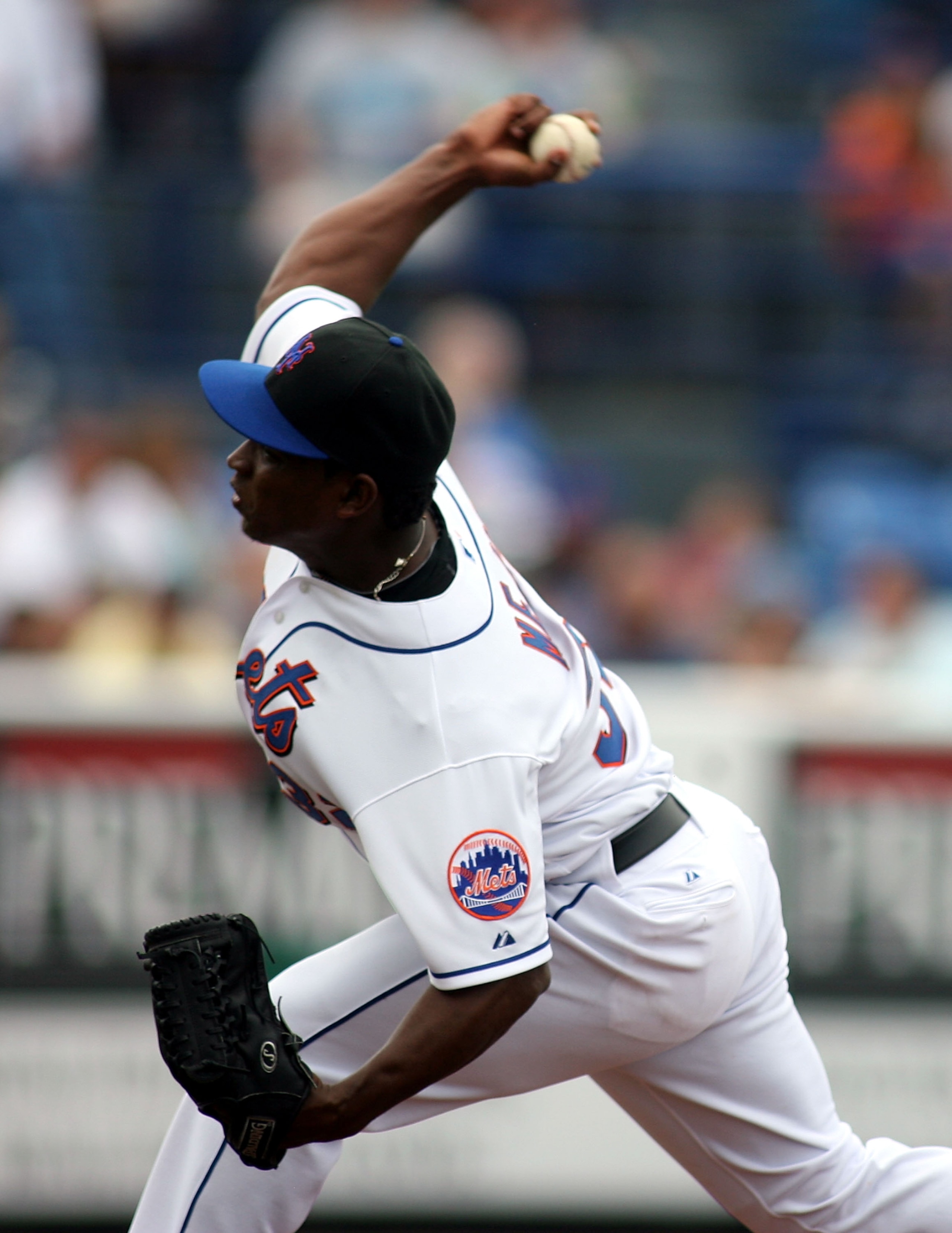 PORT ST. LUCIE, FL - FEBRUARY 26: Jenrry Mejia #32 of the New York Mets throws against the Atlanta Braves at Digital Domain Park on February 26, 2011 in Port St. Lucie, Florida.  (Photo by Marc Serota/Getty Images)