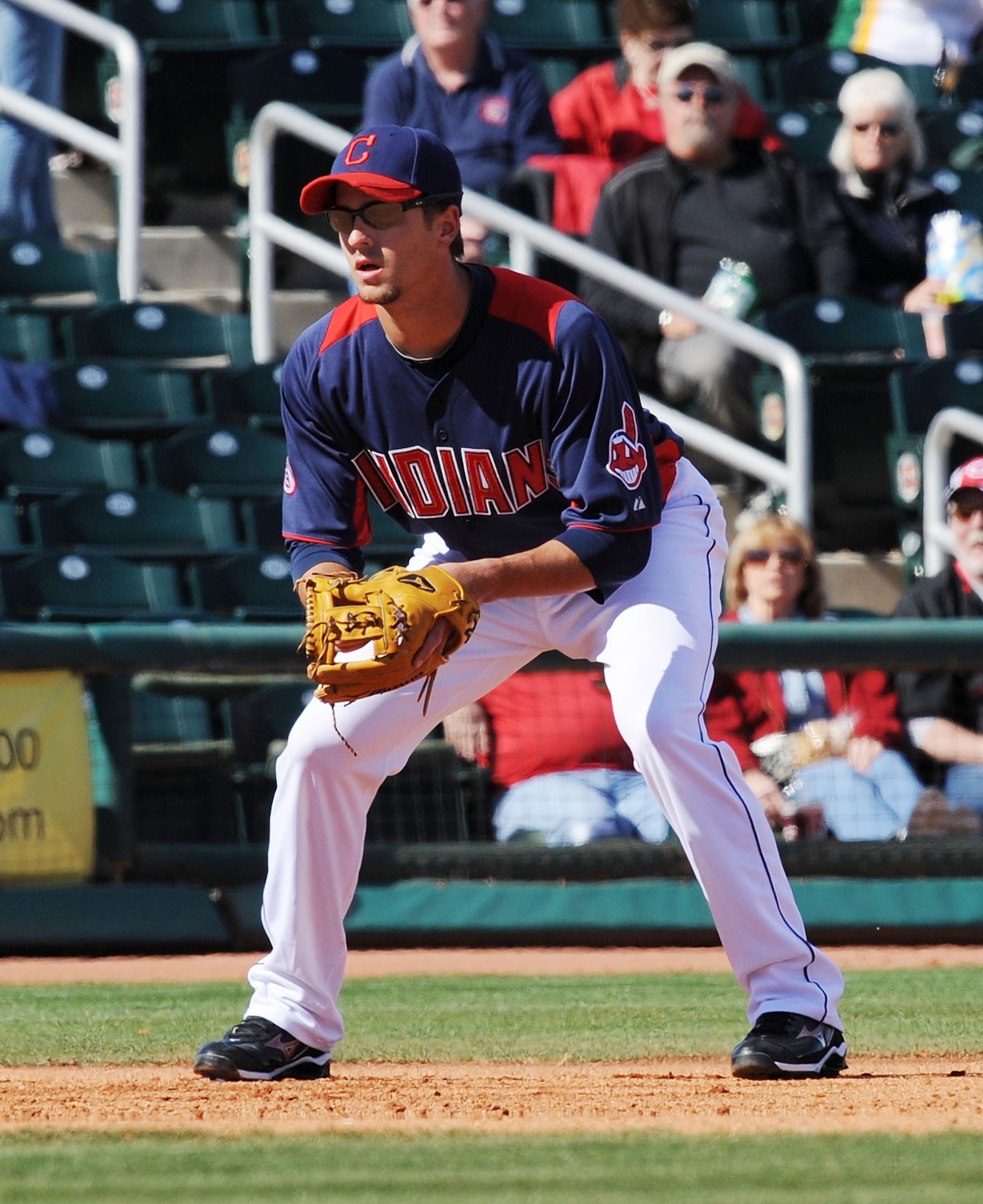 GOODYEAR, AZ - FEBRUARY 27:  Lonnie Chisenhall #76 of the Cleveland Indians gets ready at third base against the Cincinnati Reds at Goodyear Ballpark on February 27, 2011 in Goodyear, Arizona.  (Photo by Norm Hall/Getty Images)