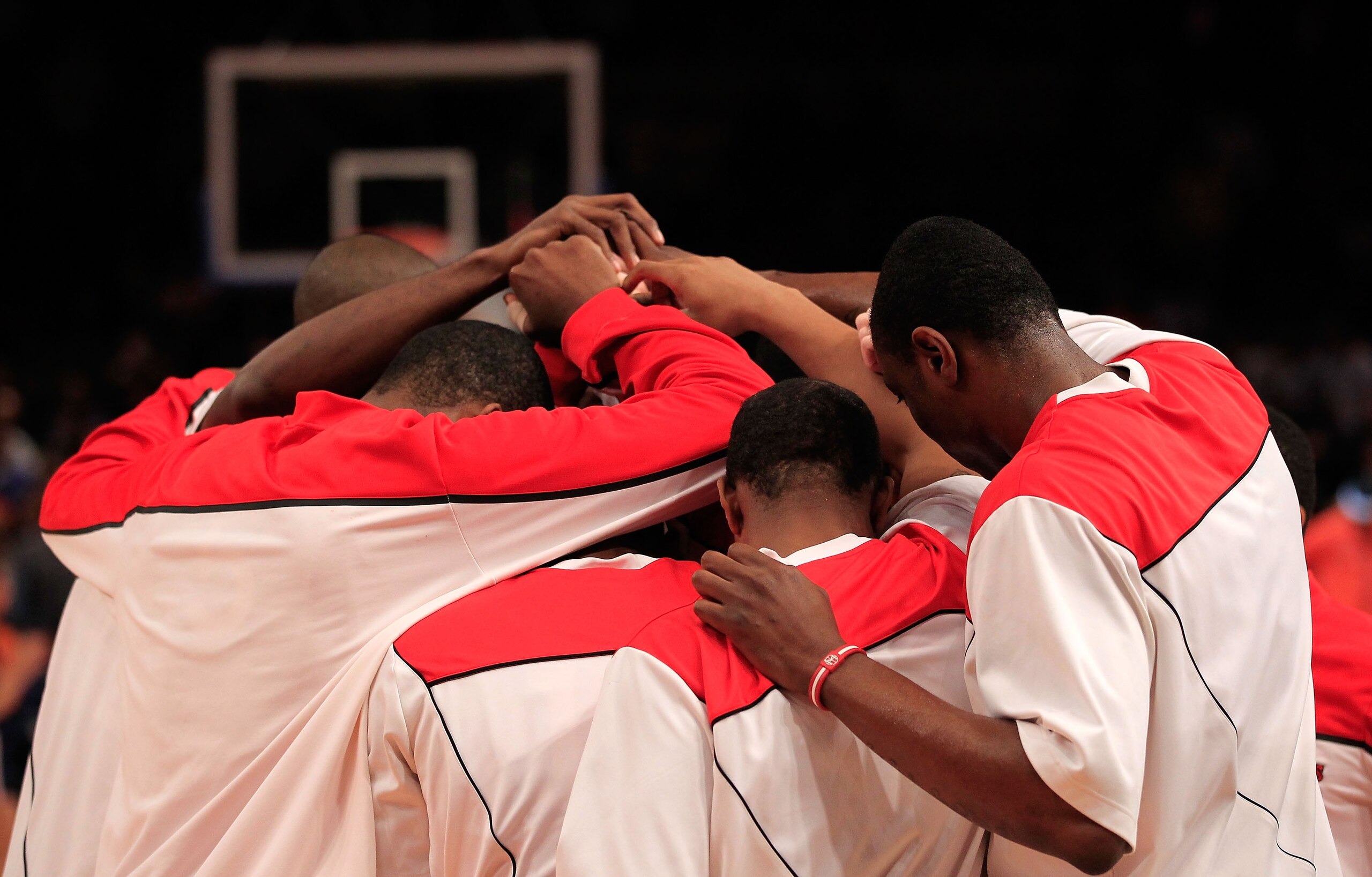 NEW YORK, NY - MARCH 10: The St. John's Red Storm huddles before their game against the Syracuse Orange during the quarterfinals of the 2011 Big East Men's Basketball Tournament presented by American Eagle Outfitters  at Madison Square Garden on March 10,