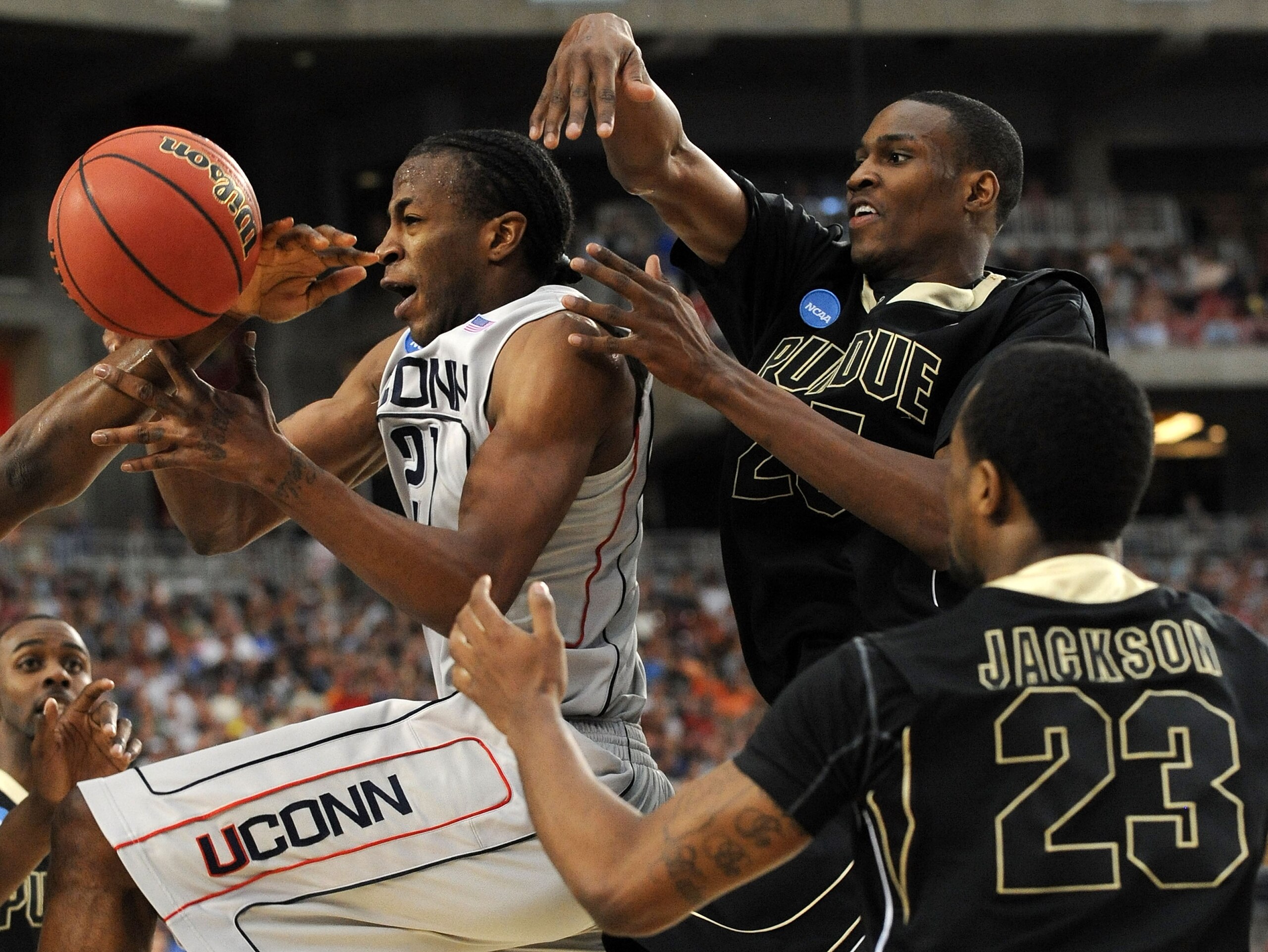 GLENDALE, AZ - MARCH 26:  Forward Stanley Robinson #21 of the Connenticut Huskies loses control of the ball against the Purdue Boilermakers in the Sweet 16 of the NCAA Division I Men's Basketball Tournament at the University of Phoenix Stadium on March 26