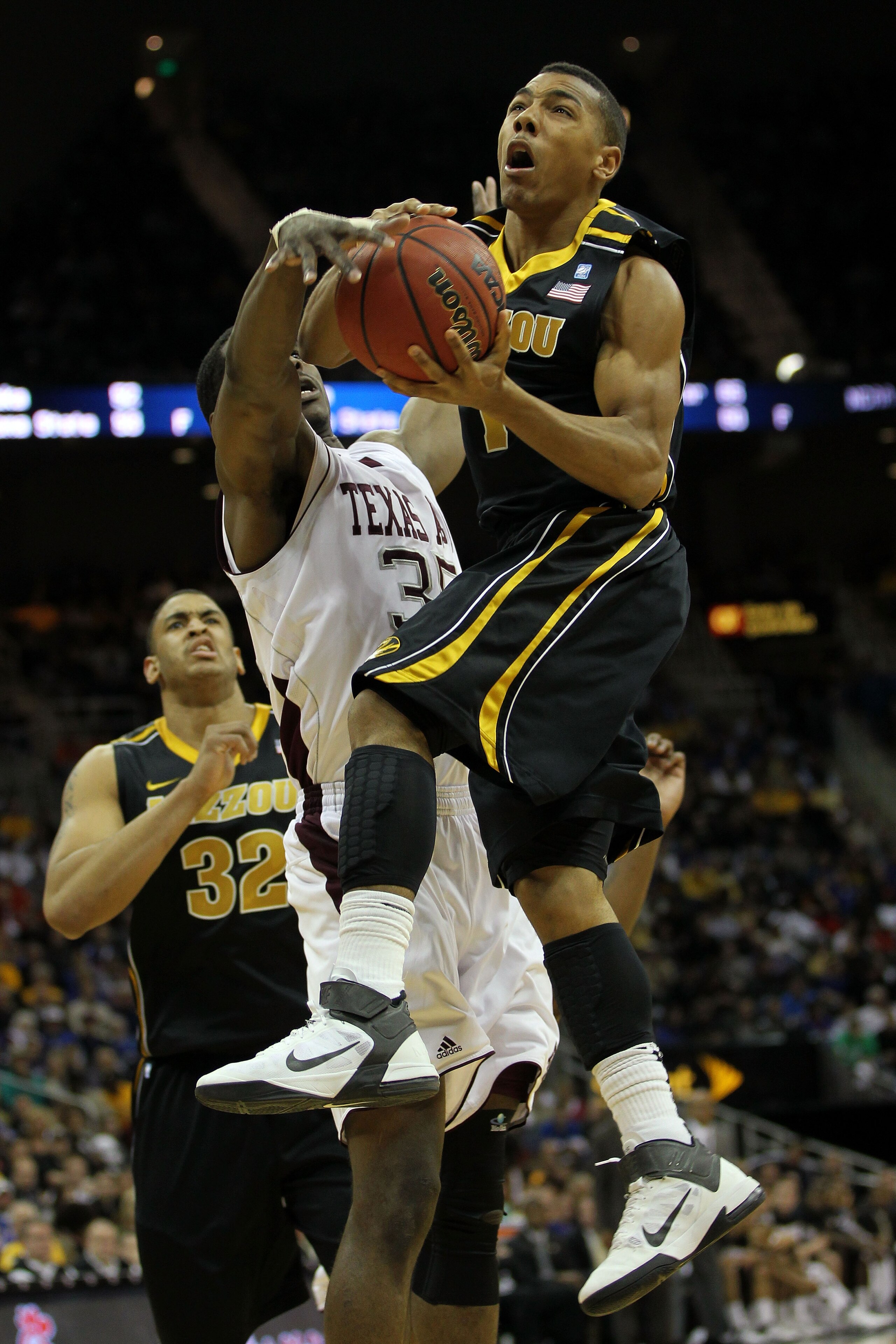 KANSAS CITY, MO - MARCH 10:  Phil (Flip) Pressey #1 of the Missouri Tigers goes up for a shot against Ray Turner #35 of the Texas A&M Aggies during their quarterfinal game in the 2011 Phillips 66 Big 12 Men's Basketball Tournament at Sprint Center on Marc