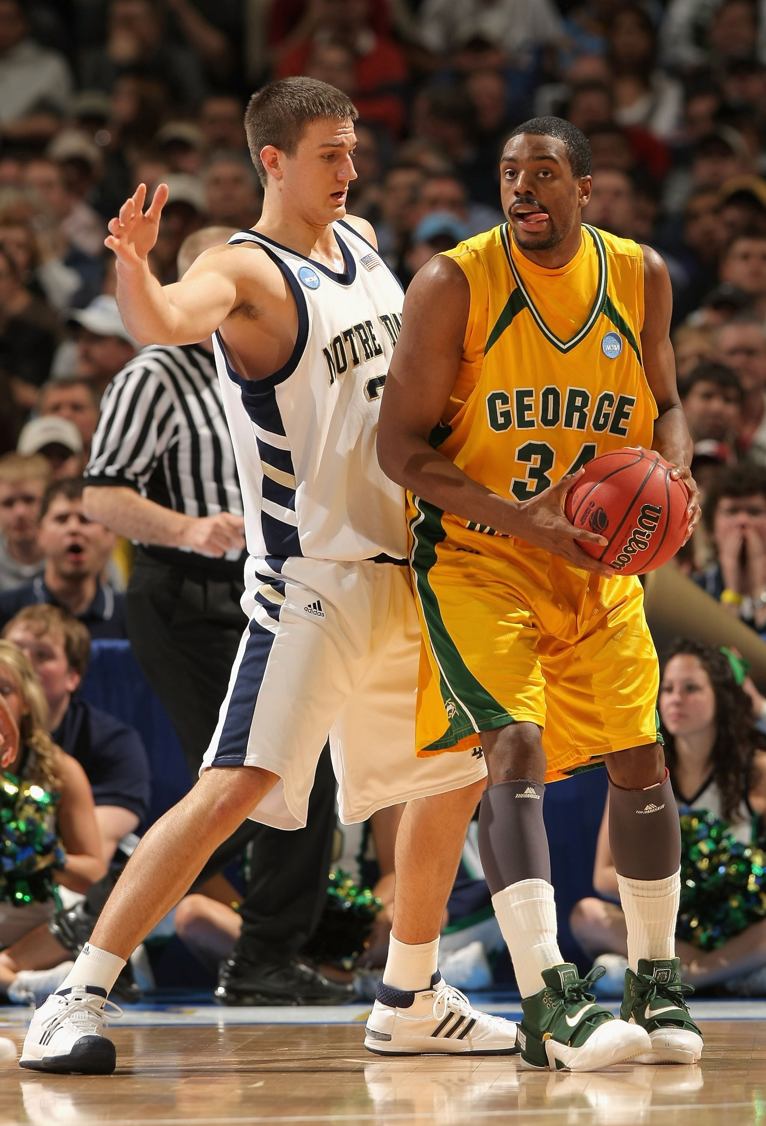 DENVER - MARCH 20:  Will Thomas #34 of the George Mason Patriots handles the ball against the Notre Dame Fighting Irish during the first round of the East Regional as part of the 2008 NCAA Men's Basketball Tournament at Pepsi Center on March 20, 2008 in D