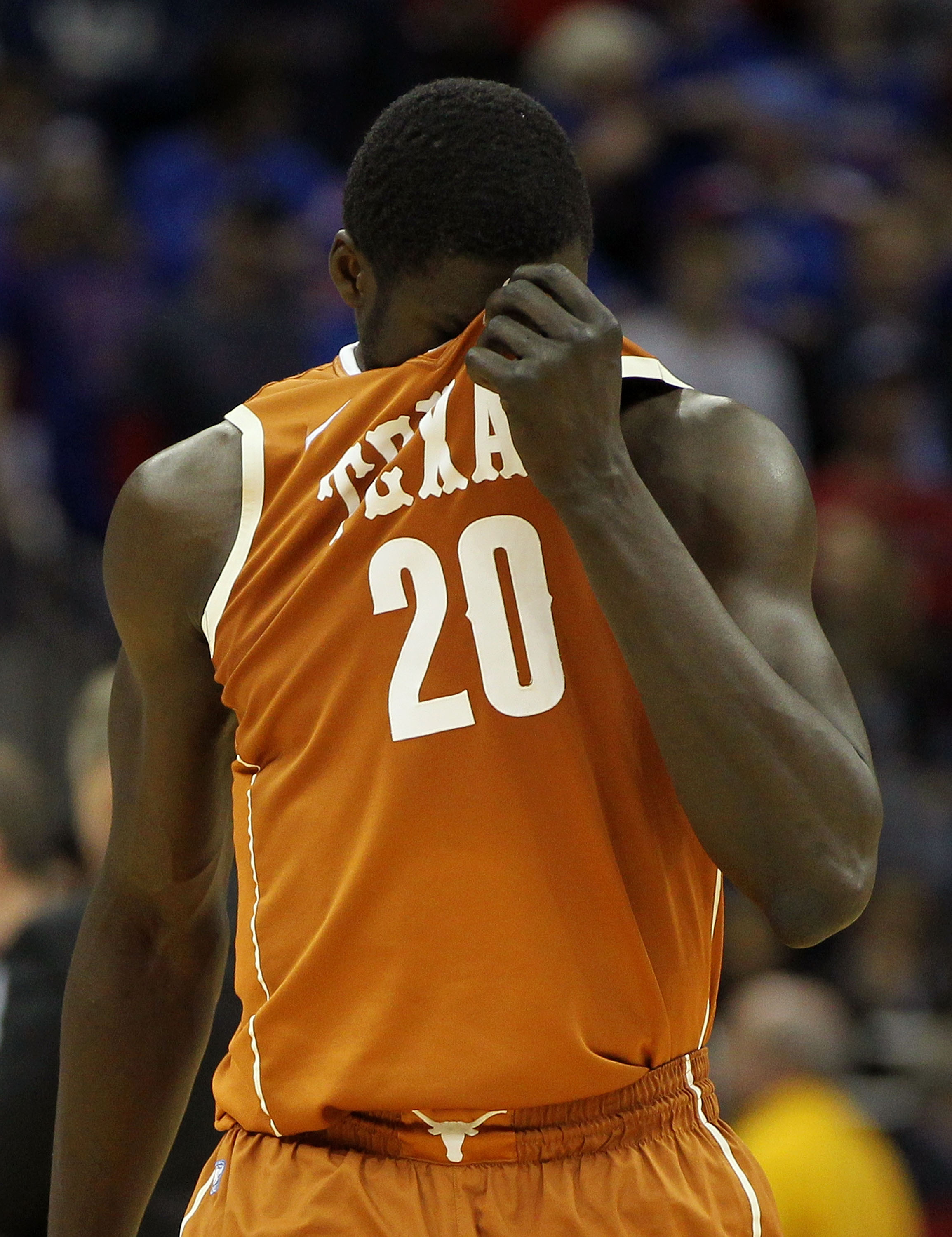 KANSAS CITY, MO - MARCH 12: Alexis Wangmene #20 of the Texas Longhorns reacts after a play against the Kansas Jayhawks during the 2011 Phillips 66 Big 12 Men's Basketball Tournament championship game at Sprint Center on March 12, 2011 in Kansas City, Mis