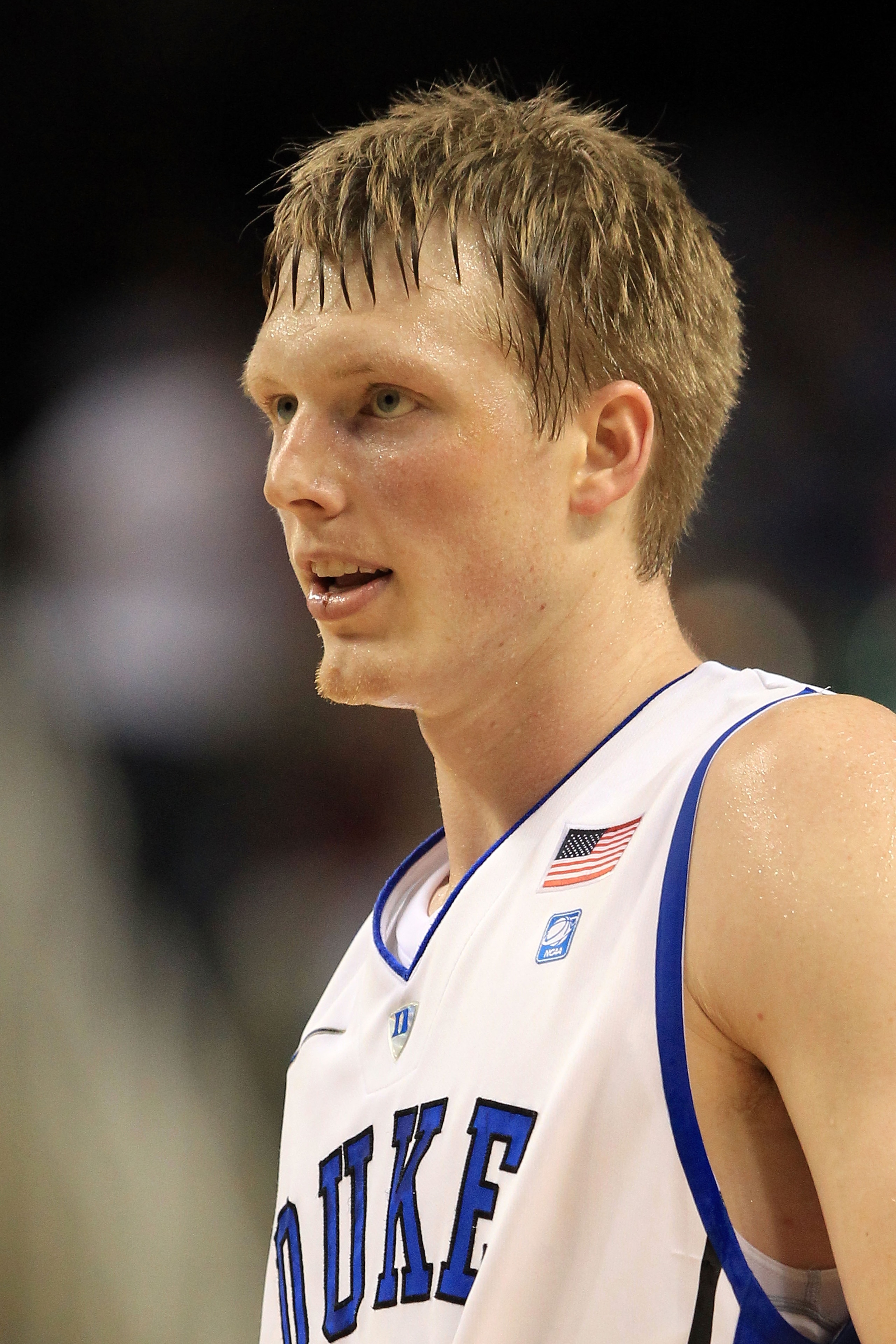 GREENSBORO, NC - MARCH 12:  Kyle Singler #12 of the Duke Blue Devils looks on during the first half against the Virginia Tech Hokies in the semifinals of the 2011 ACC men's basketball tournament at the Greensboro Coliseum on March 12, 2011 in Greensboro,