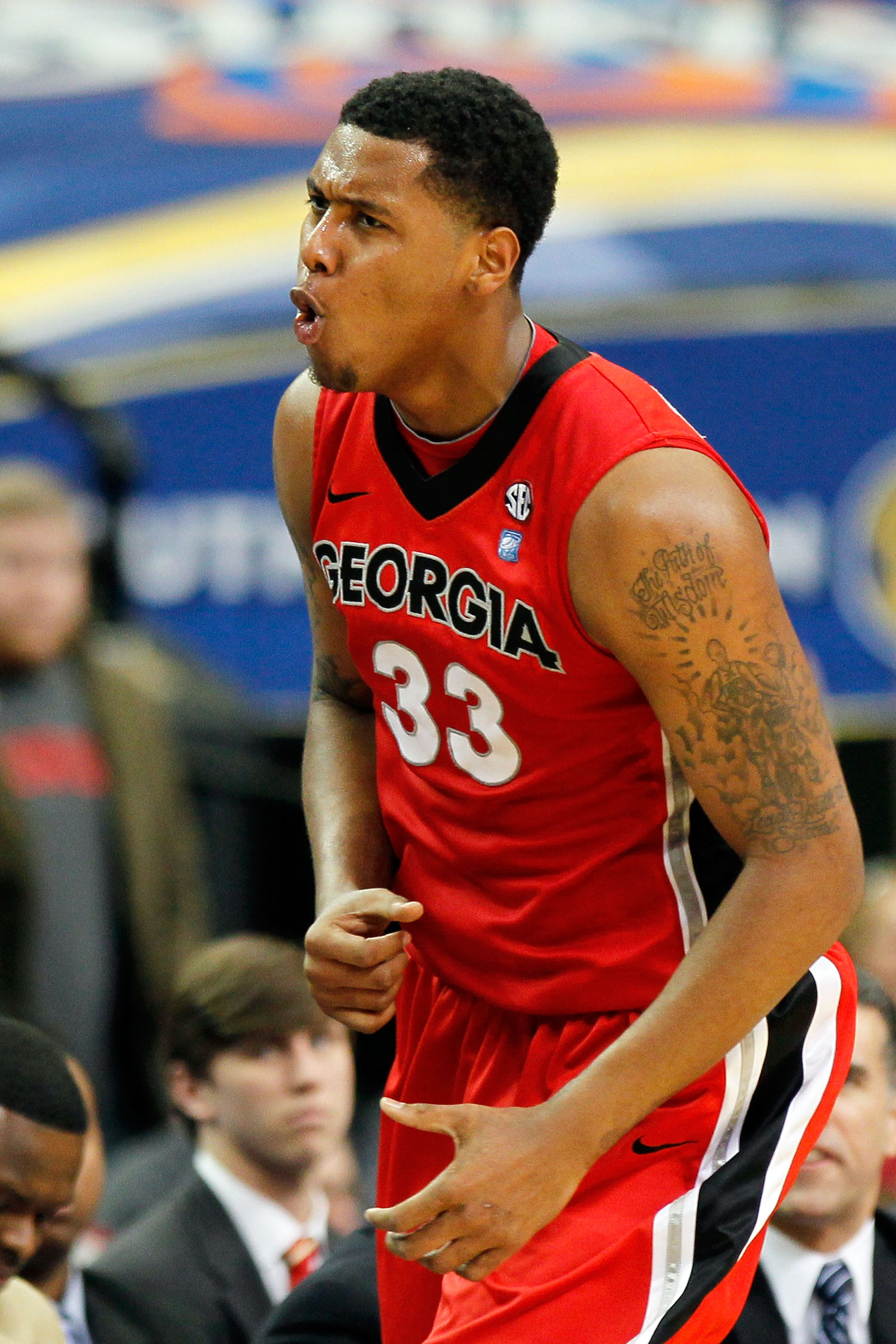 ATLANTA, GA - MARCH 11: Trey Thompkins #33 of the Georgia Bulldogs celebrates after hitting a 3 point shot against the Alabama Crimson Tide during the quarterfinals of the SEC Men's Basketball Tournament at Georgia Dome on March 11, 2011 in Atlanta, Geor