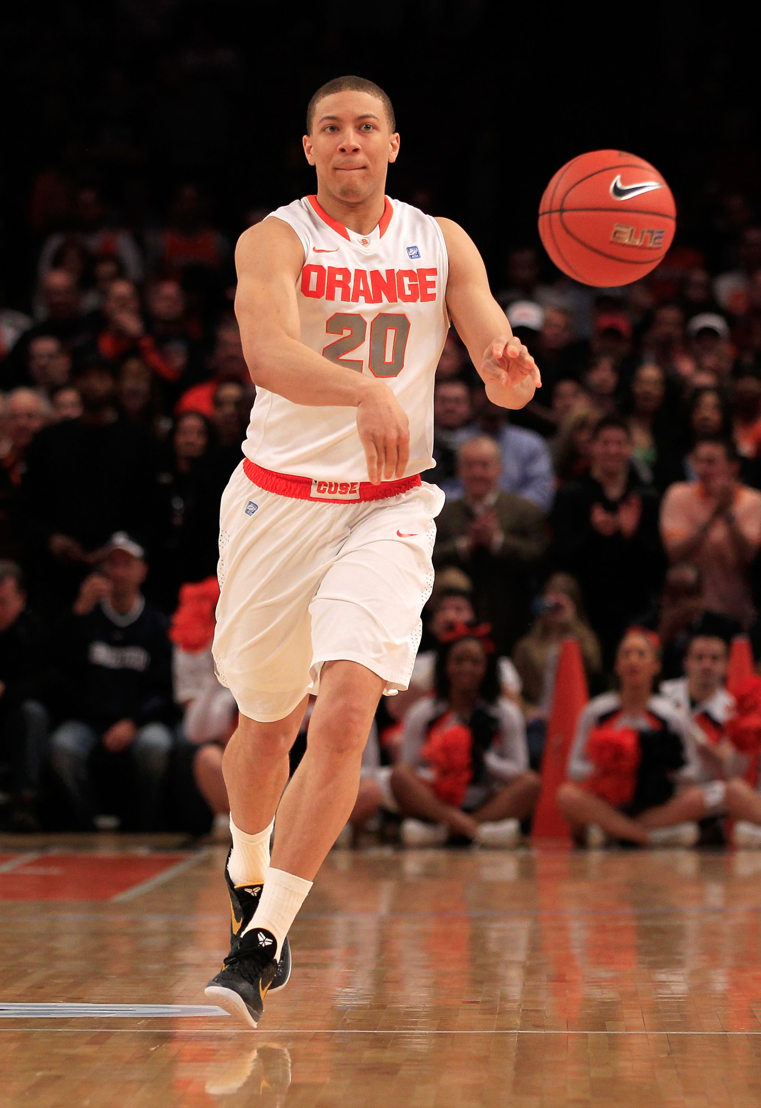 NEW YORK, NY - MARCH 11: Brandon Triche #20 of the Syracuse Orange passes the ball against the Connecticut Huskies during the semifinals of the 2011 Big East Men's Basketball Tournament presented by American Eagle Outfitters at Madison Square Garden on Ma