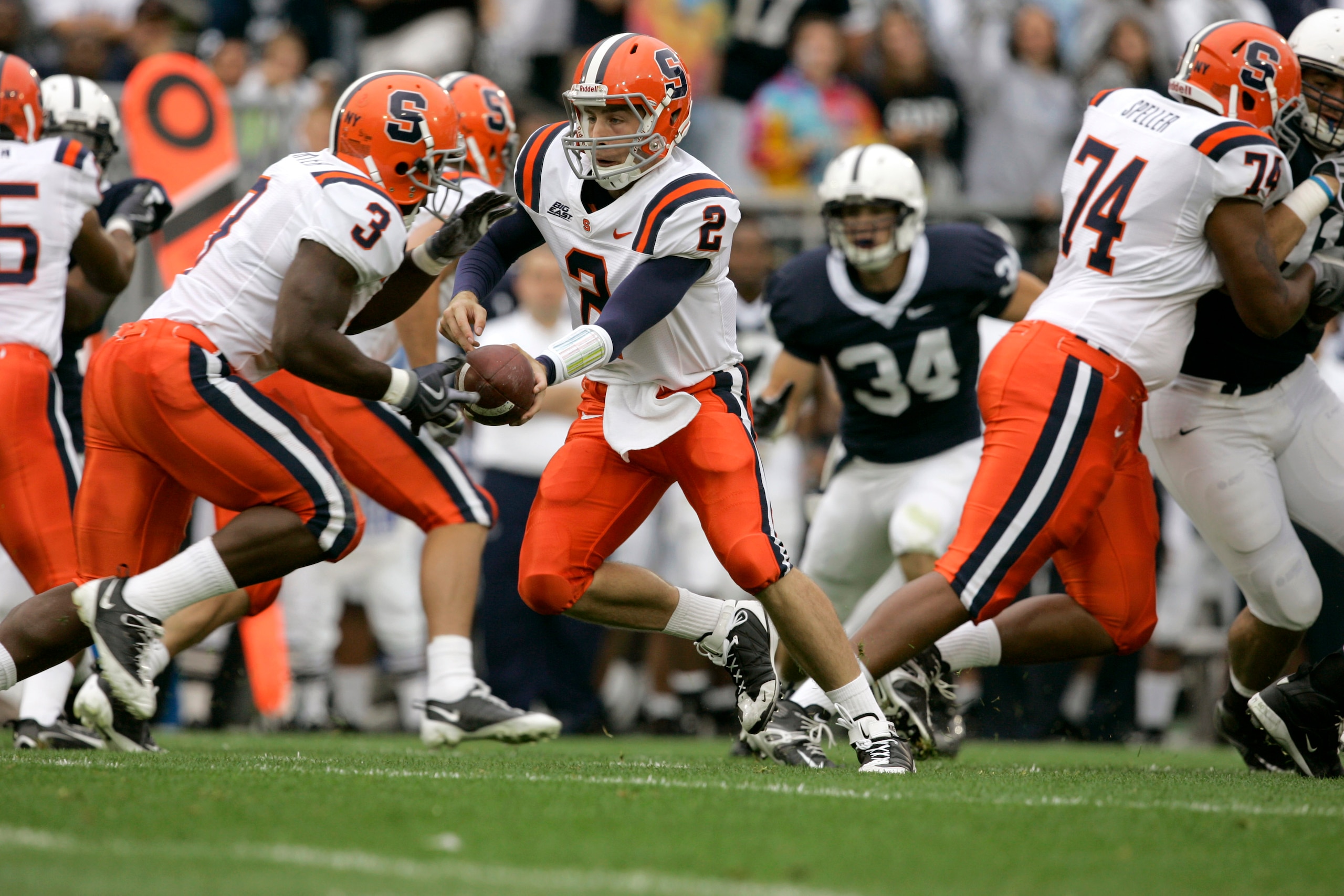 STATE COLLEGE, PA - SEPTEMBER 12: Quarterback Greg Paulus #2 of the Syracuse Orangemen hands off to running back Delone Carter #3 during the first half against the Penn State Nittany Lions at Beaver Stadium  September 12, 2009 in State College, Pennsylvan
