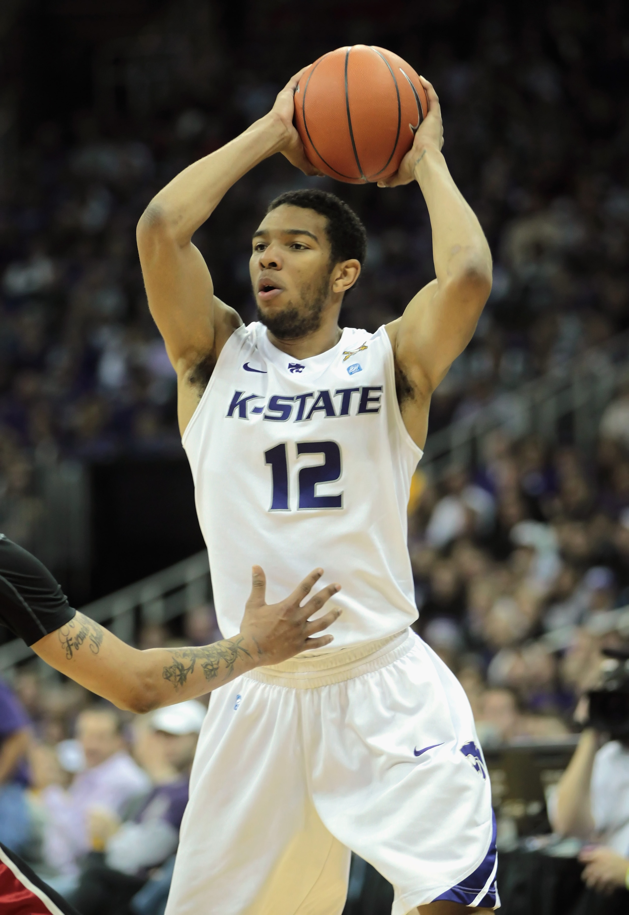 KANSAS CITY, MO - DECEMBER 21:  Nick Russell #12 of the Kansas State Wildcats in action during the game against the UNLV Rebels on December 21, 2010 at the Sprint Center in Kansas City, Missouri.  (Photo by Jamie Squire/Getty Images)